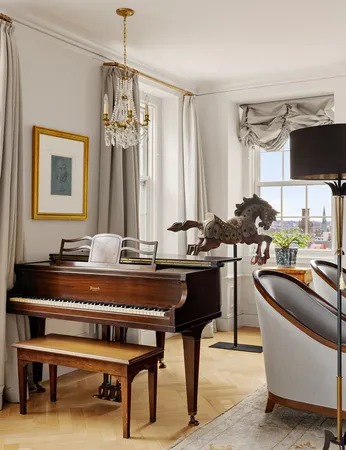 a view of a livingroom with workspace and a couch