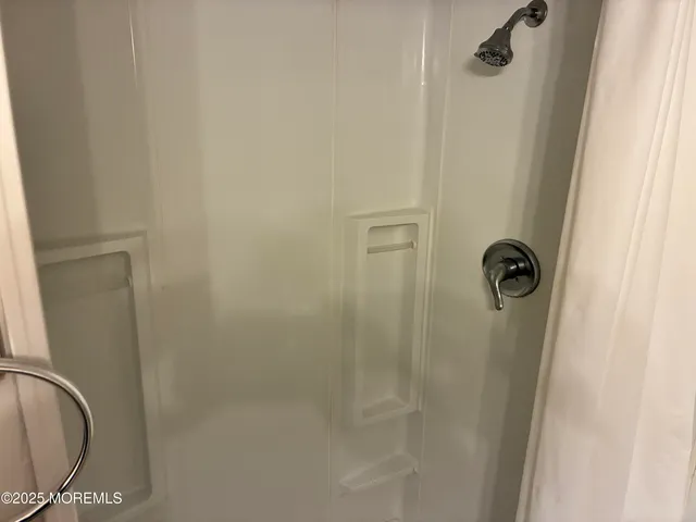 a close view of a shower in bathroom