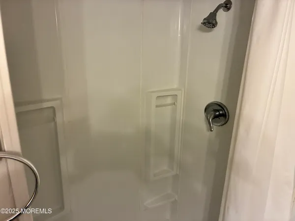 a close view of a shower in bathroom