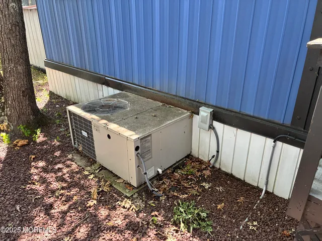 a kitchen with a stove and a wooden fence
