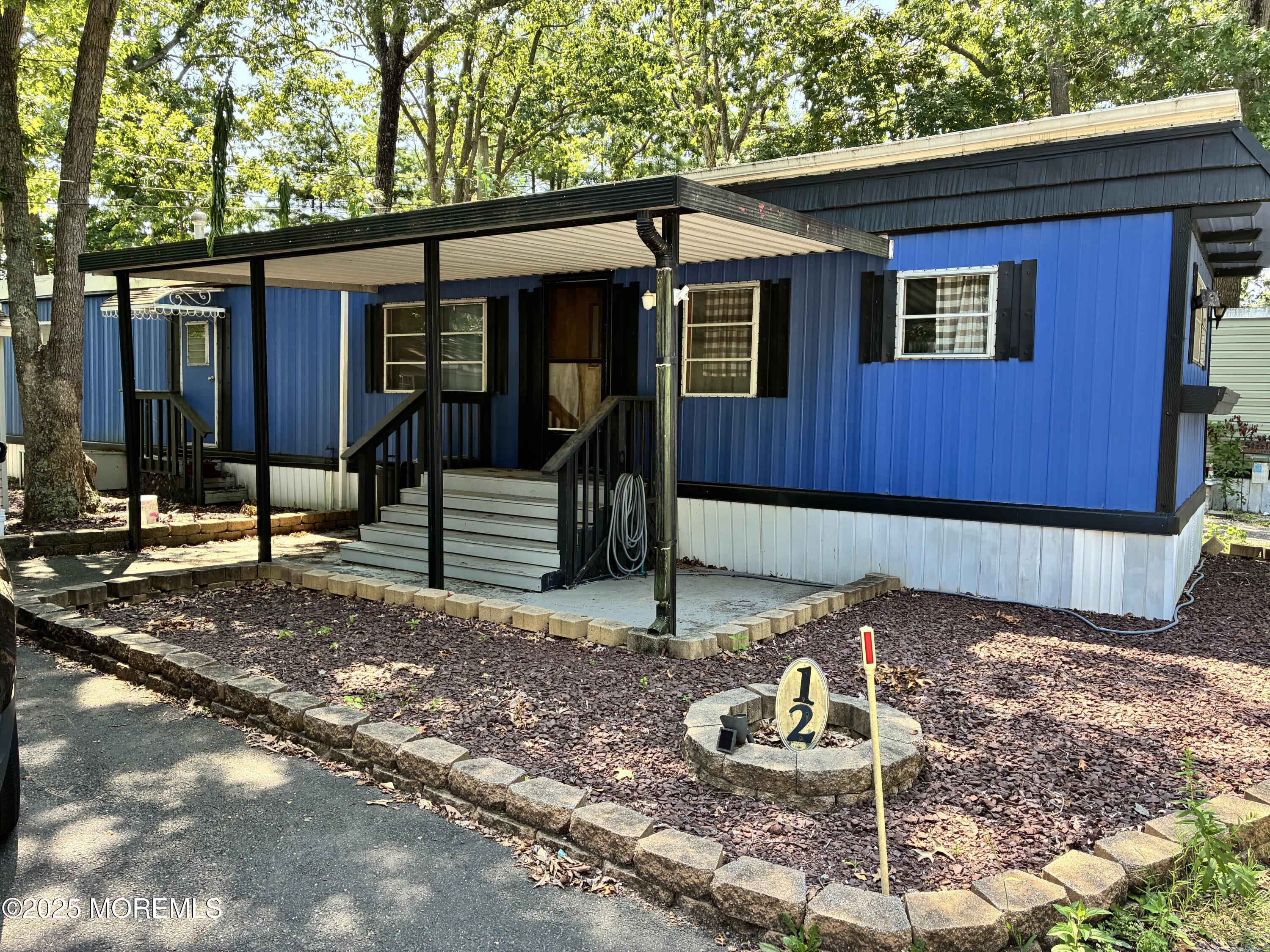 12 D Trail Brick, NJ 08724 - Photo 7 of 17 a backyard of a house with barbeque oven