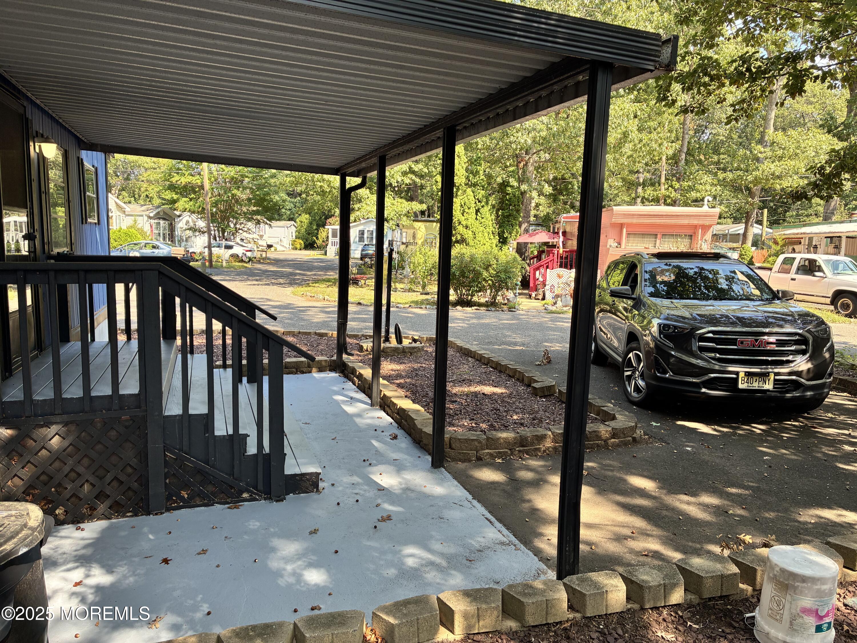 12 D Trail Brick, NJ 08724 - Photo 9 of 17 a view of a car park from a balcony