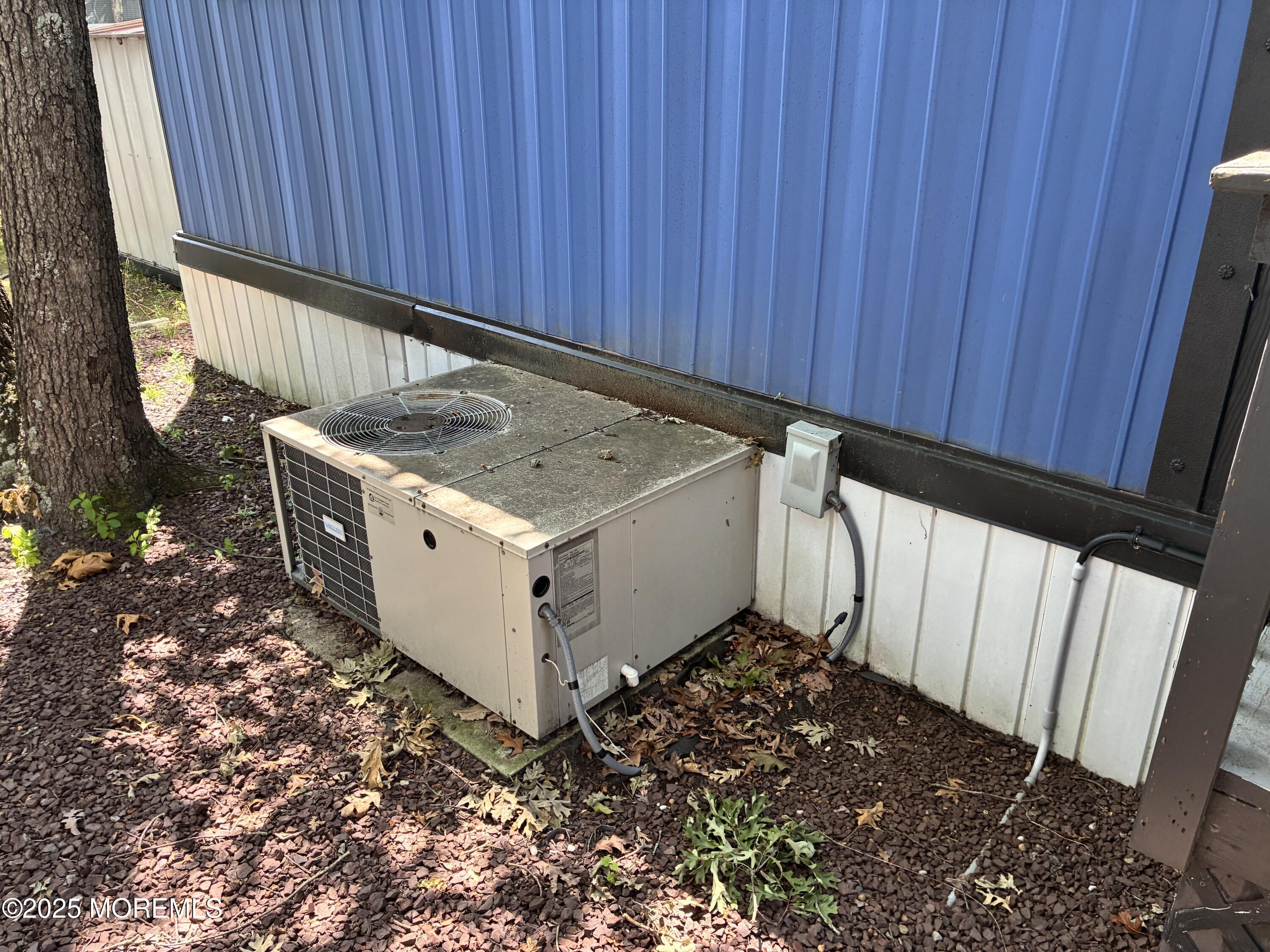 12 D Trail Brick, NJ 08724 - Photo 10 of 17 a kitchen with a stove and a wooden fence