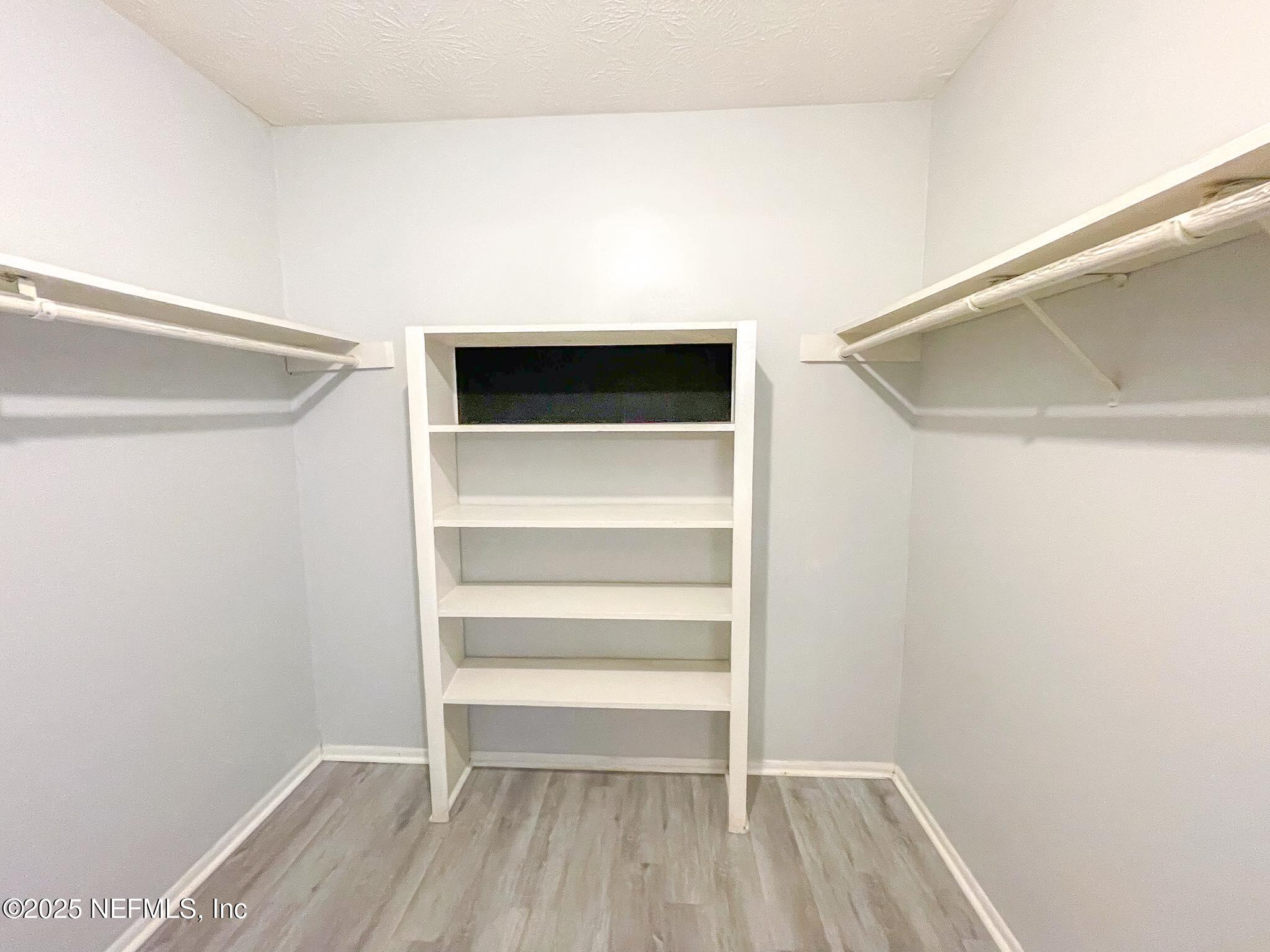 4915 Baymeadows Road, Unit 13D Jacksonville, FL 32217 - Photo 15 of 23 a view of an empty walk in closet