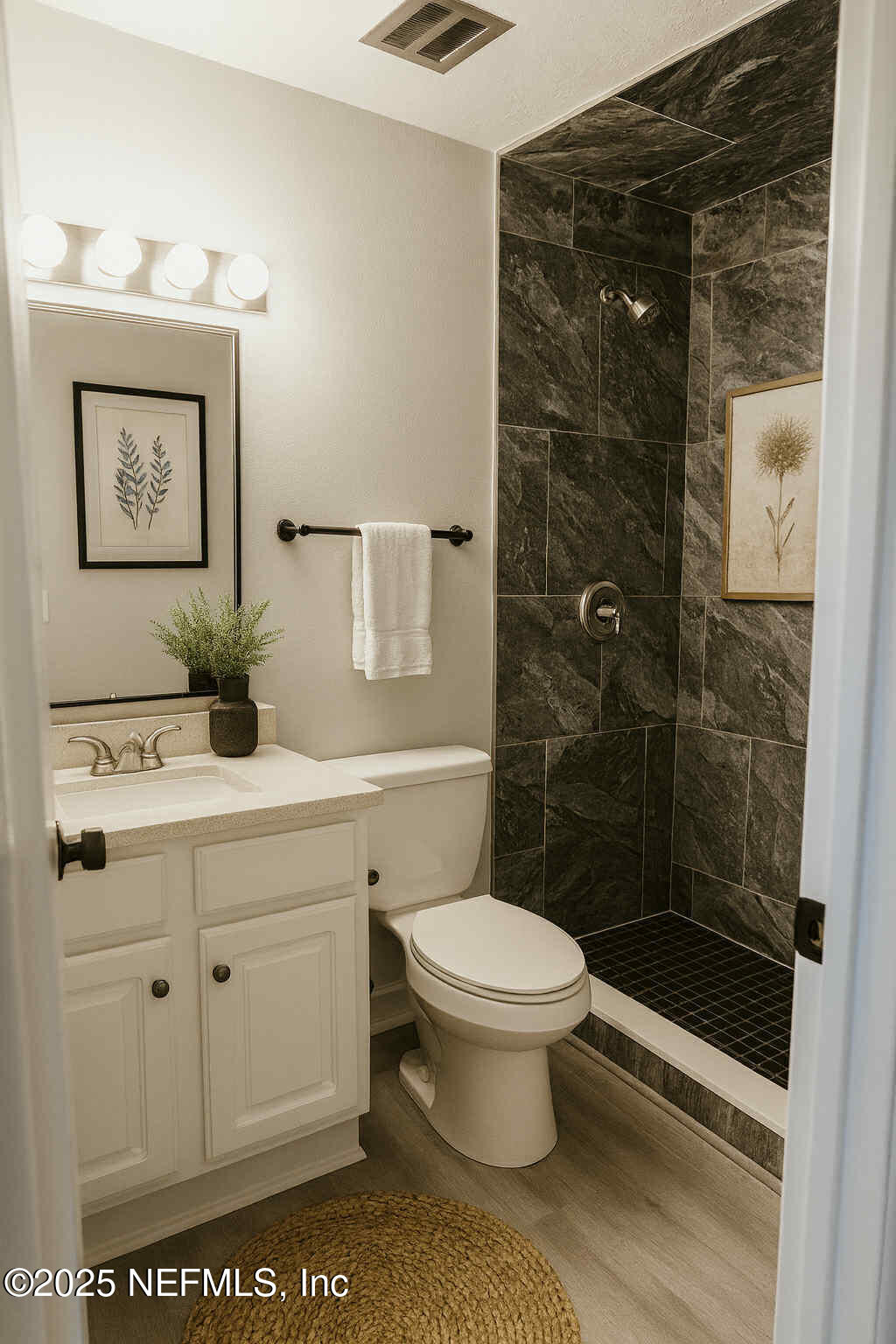 4915 Baymeadows Road, Unit 13D Jacksonville, FL 32217 - Photo 19 of 23 a bathroom with a sink a toilet and shower