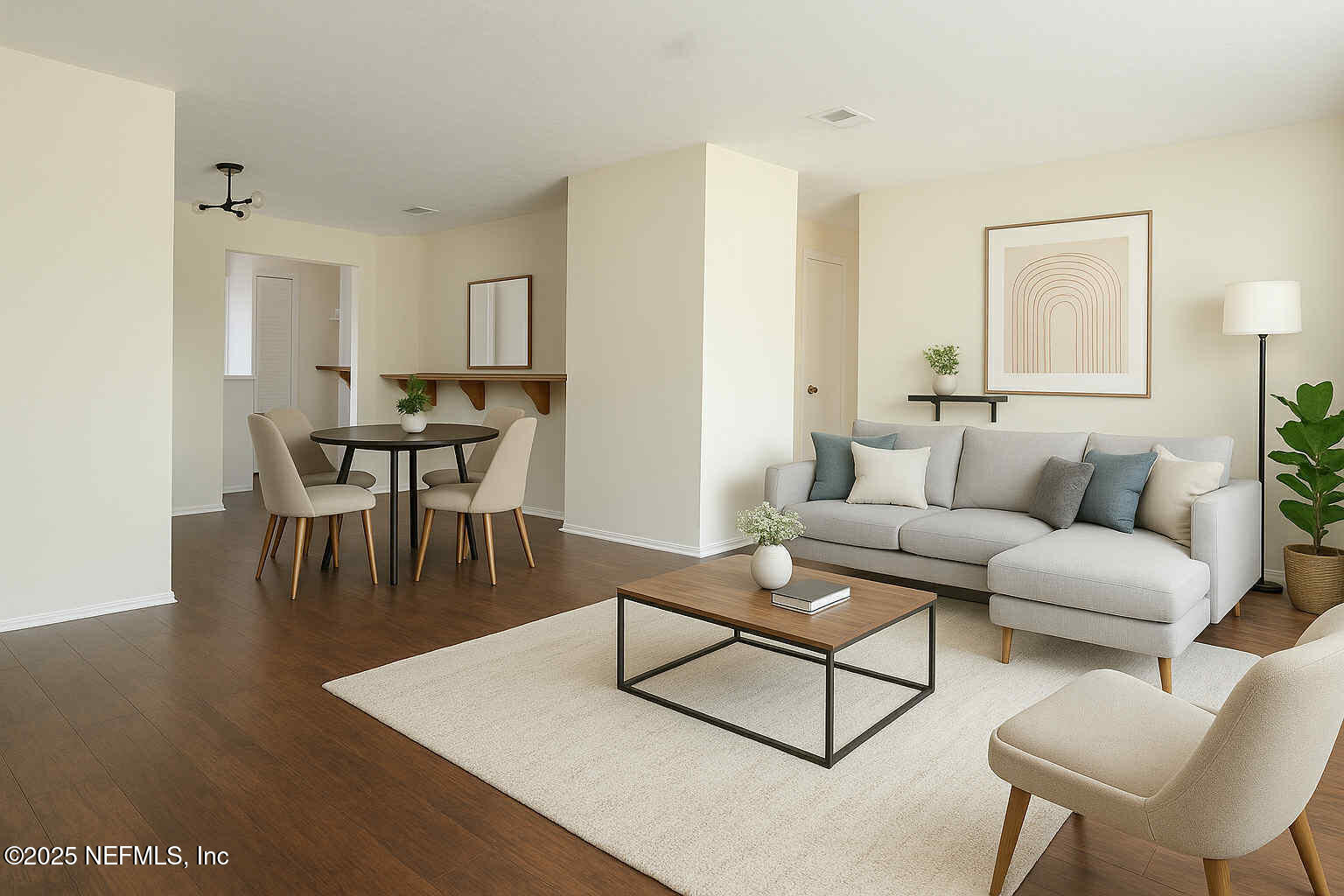 4915 Baymeadows Road, Unit 13D Jacksonville, FL 32217 - Photo 6 of 23 a living room with furniture and a wooden floor