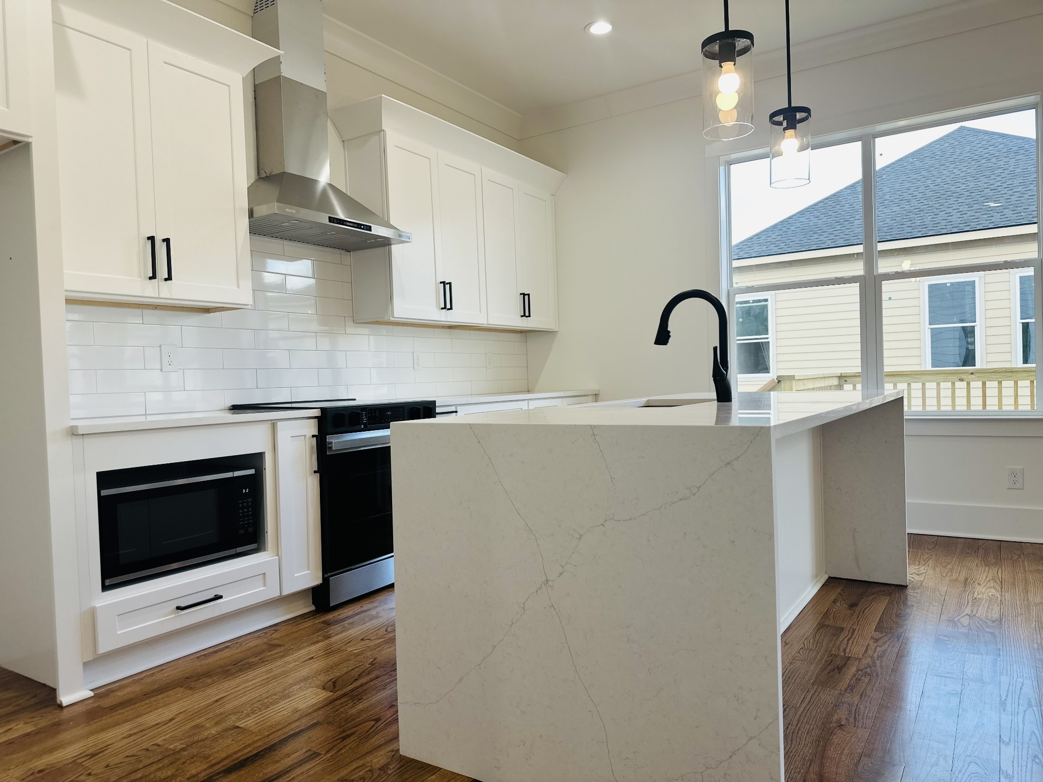 4334 Old Goins Road Nashville, TN 37211 - Photo 22 of 74 a kitchen with stainless steel appliances a sink cabinets and wooden floor