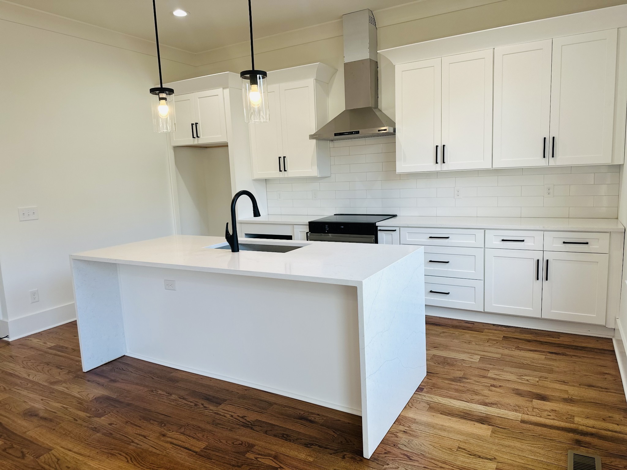 4334 Old Goins Road Nashville, TN 37211 - Photo 27 of 74 a kitchen with stainless steel appliances granite countertop a sink a stove and a wooden floor