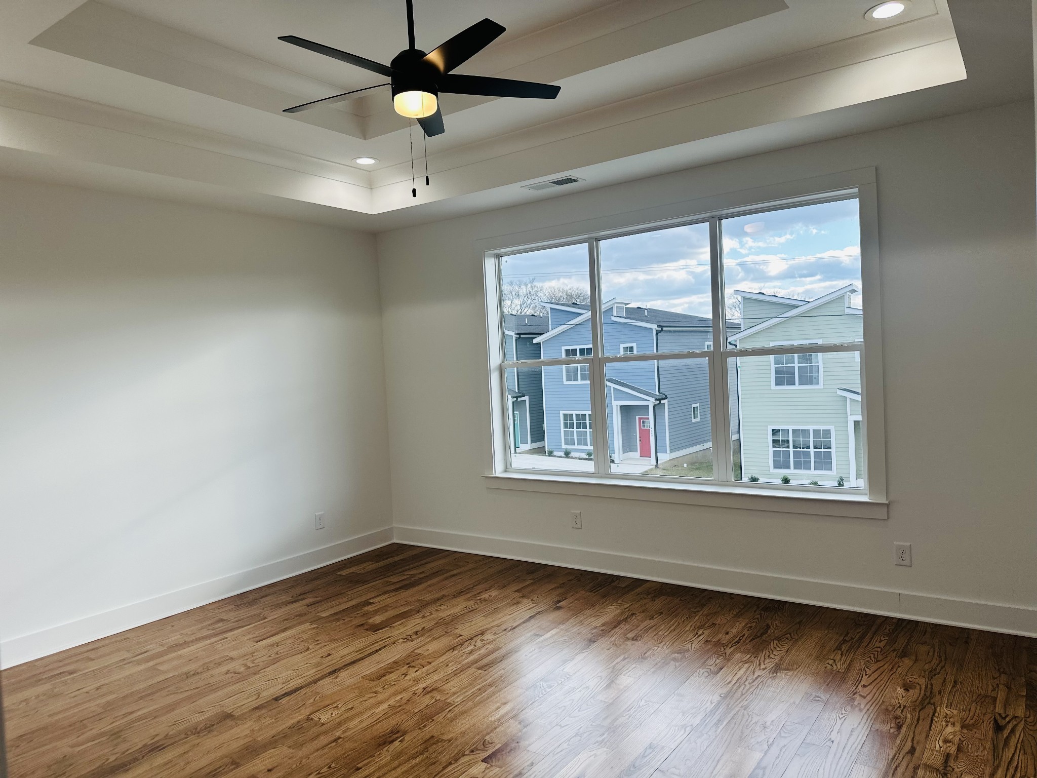 4334 Old Goins Road Nashville, TN 37211 - Photo 30 of 74 an empty room with wooden floor and windows