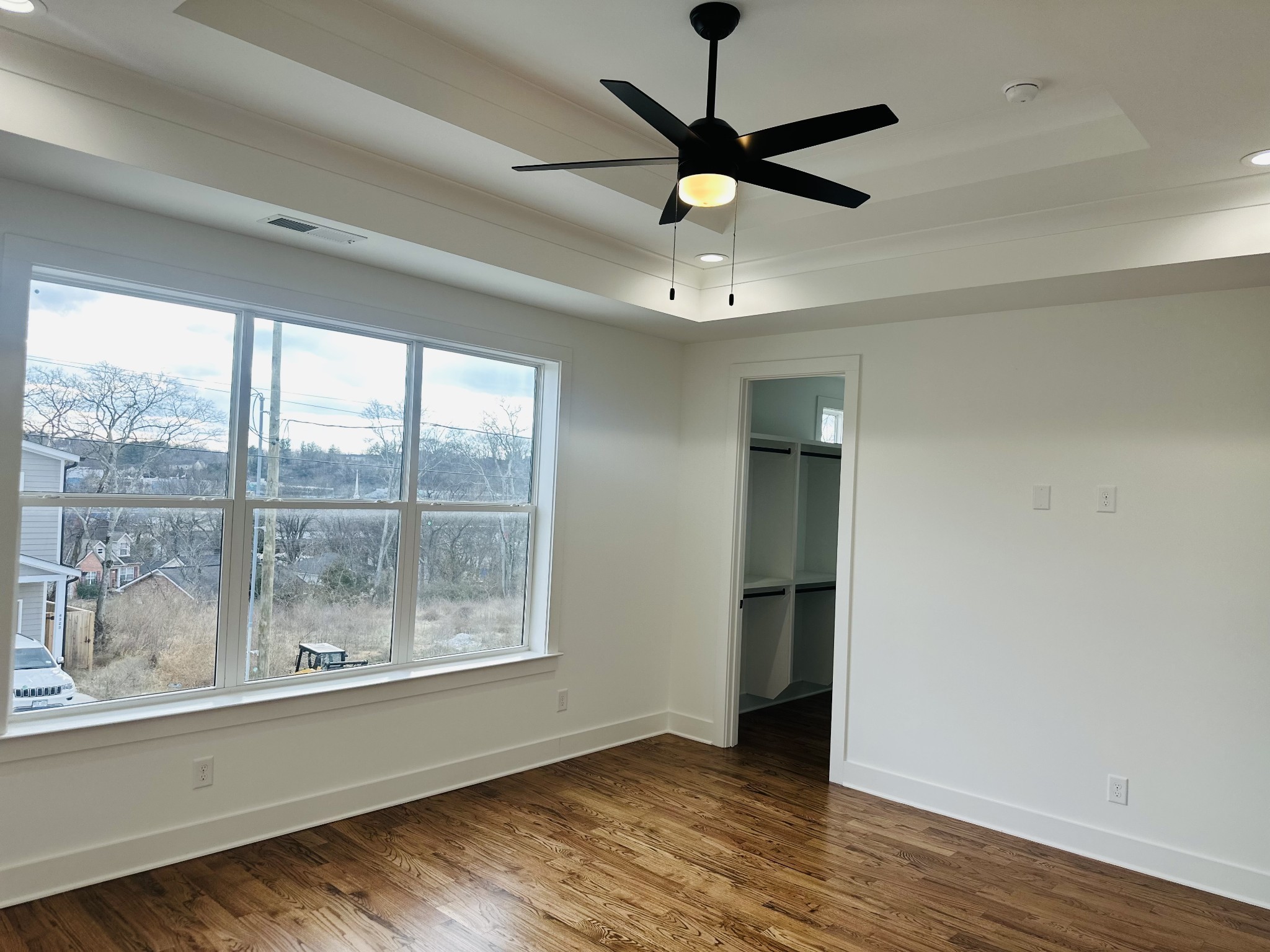 4334 Old Goins Road Nashville, TN 37211 - Photo 31 of 74 an empty room with wooden floor fan and windows