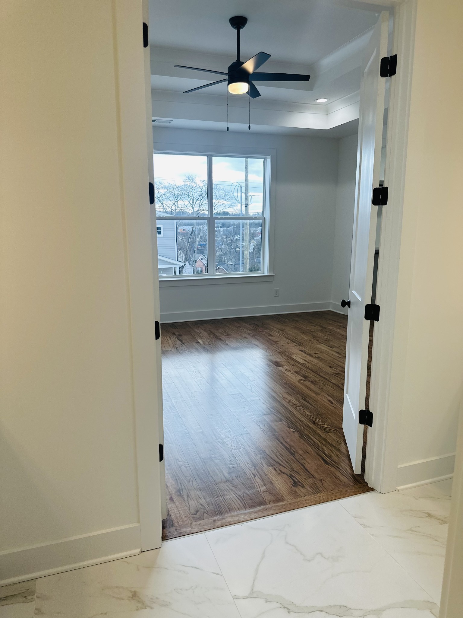 4334 Old Goins Road Nashville, TN 37211 - Photo 43 of 74 an empty room with wooden floor fan and windows