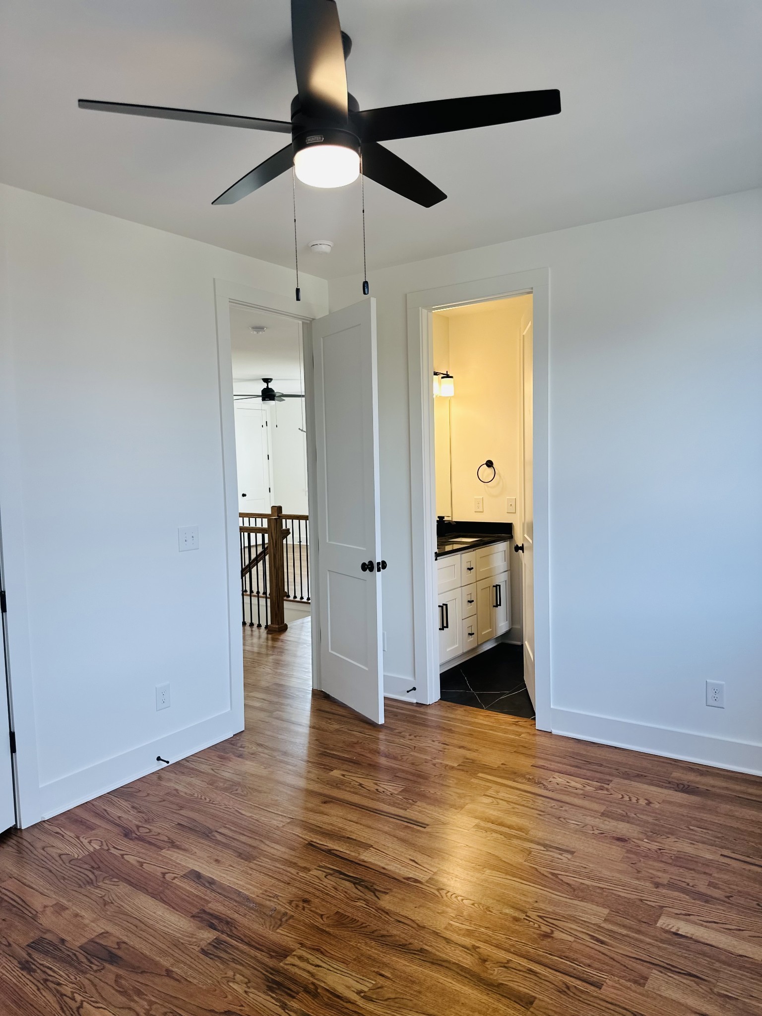 4334 Old Goins Road Nashville, TN 37211 - Photo 52 of 74 a view of a room with wooden floor and a ceiling fan