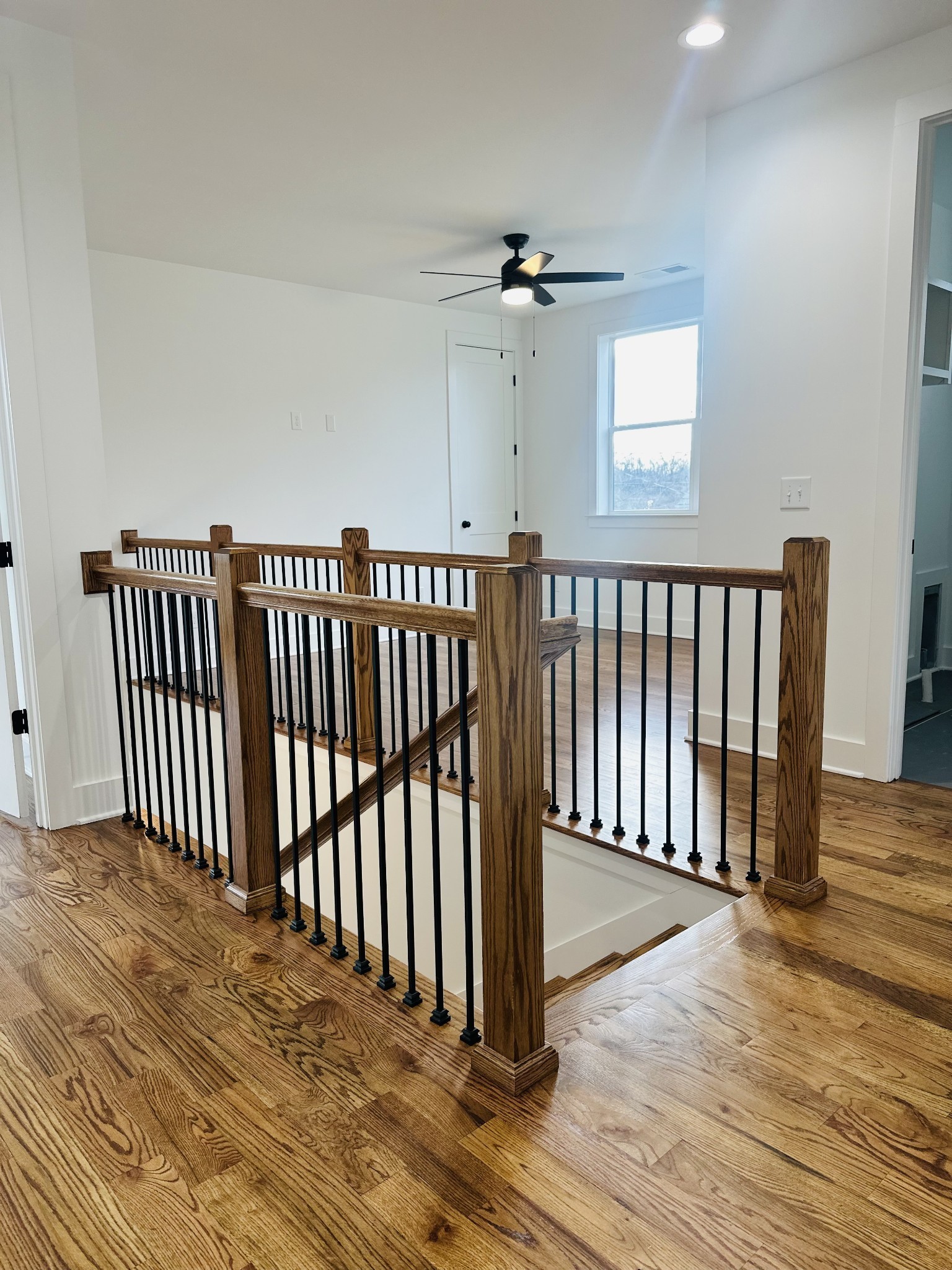 4334 Old Goins Road Nashville, TN 37211 - Photo 61 of 74 a view of a hallway with wooden floor and a chandelier