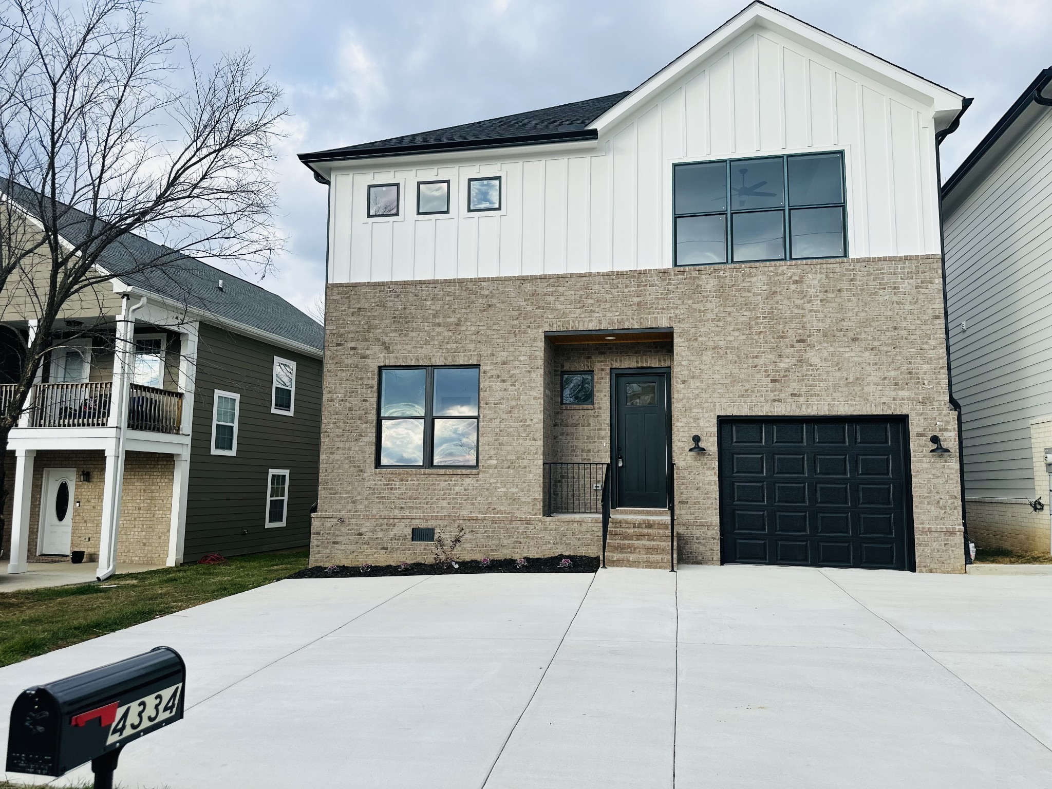4334 Old Goins Road Nashville, TN 37211 - Photo 7 of 74 a front view of a house with a yard and garage