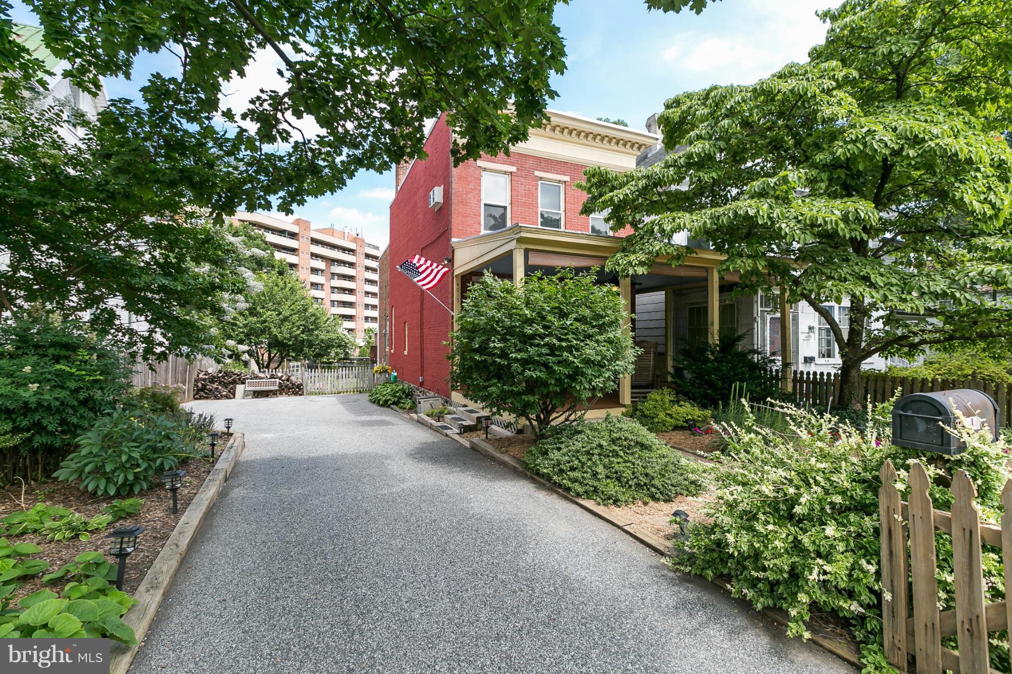 4015 Roland Avenue Baltimore, MD 21211 - Photo 1 of 30 a front view of a house with garden