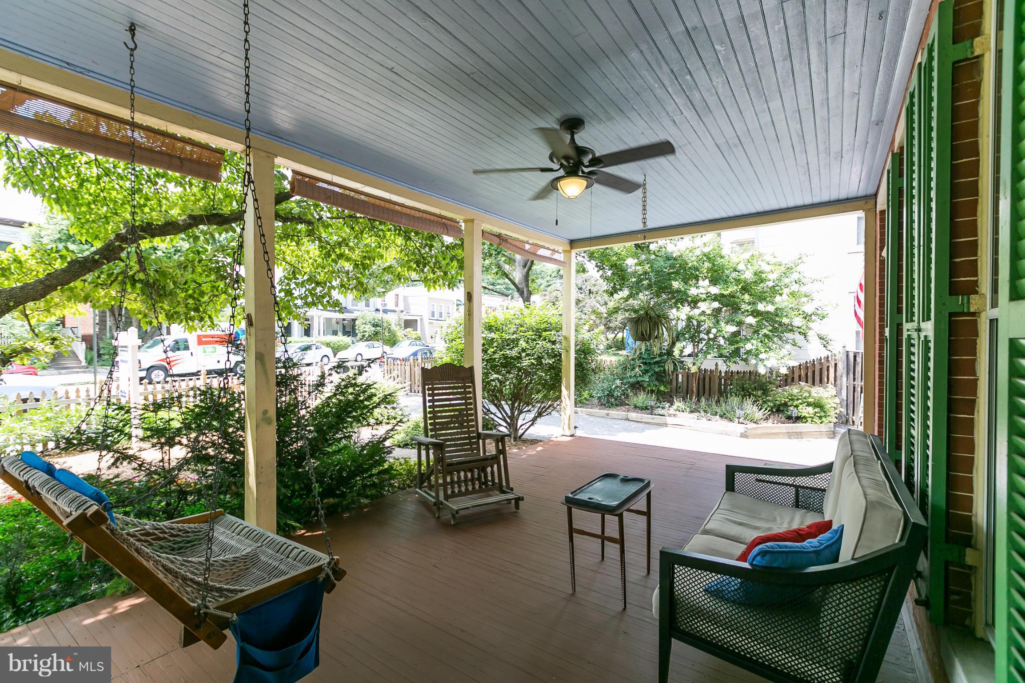 4015 Roland Avenue Baltimore, MD 21211 - Photo 2 of 30 a living room with patio furniture and a floor to ceiling window