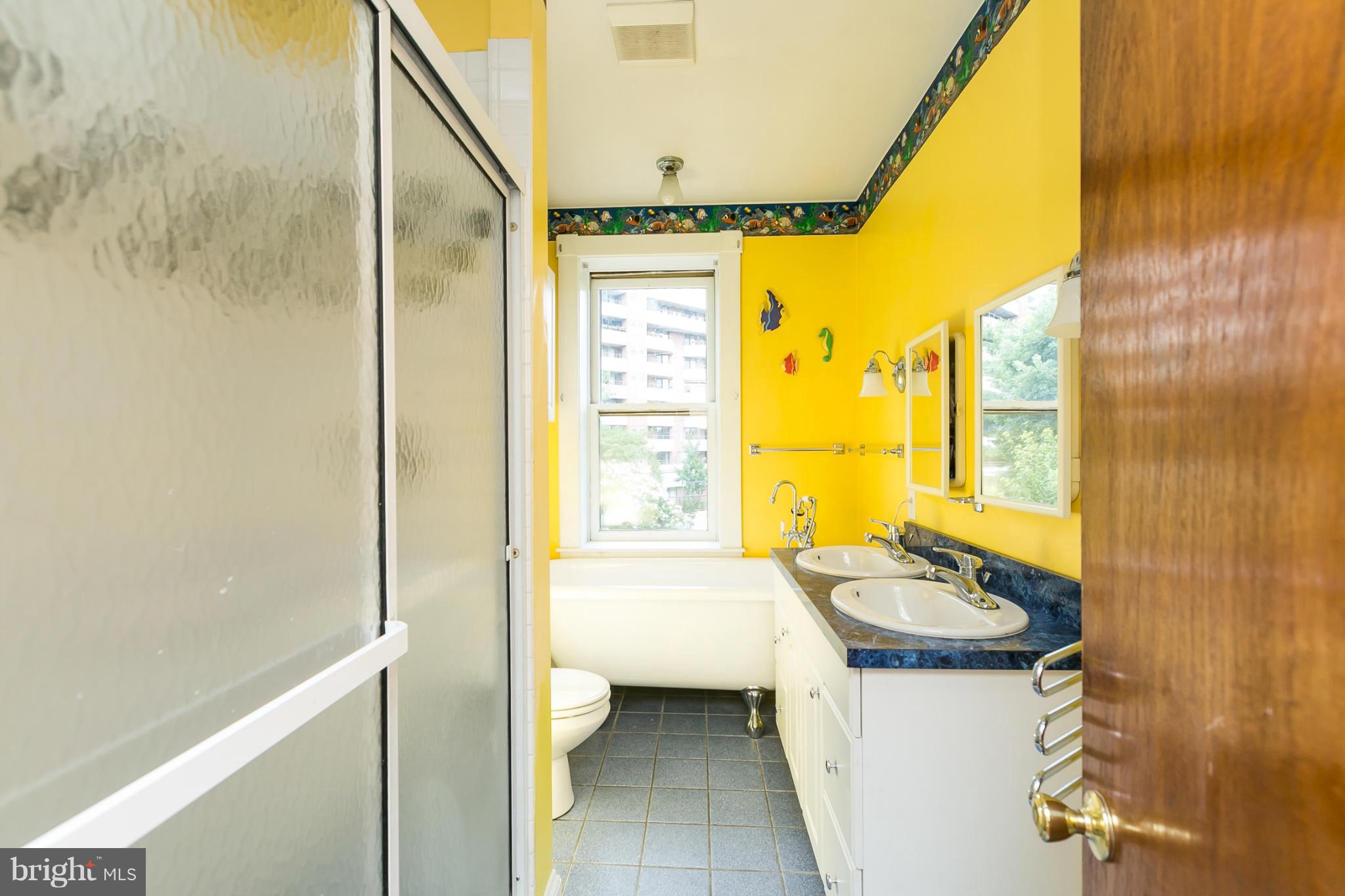 4015 Roland Avenue Baltimore, MD 21211 - Photo 20 of 30 a bathroom with a sink and a bathtub
