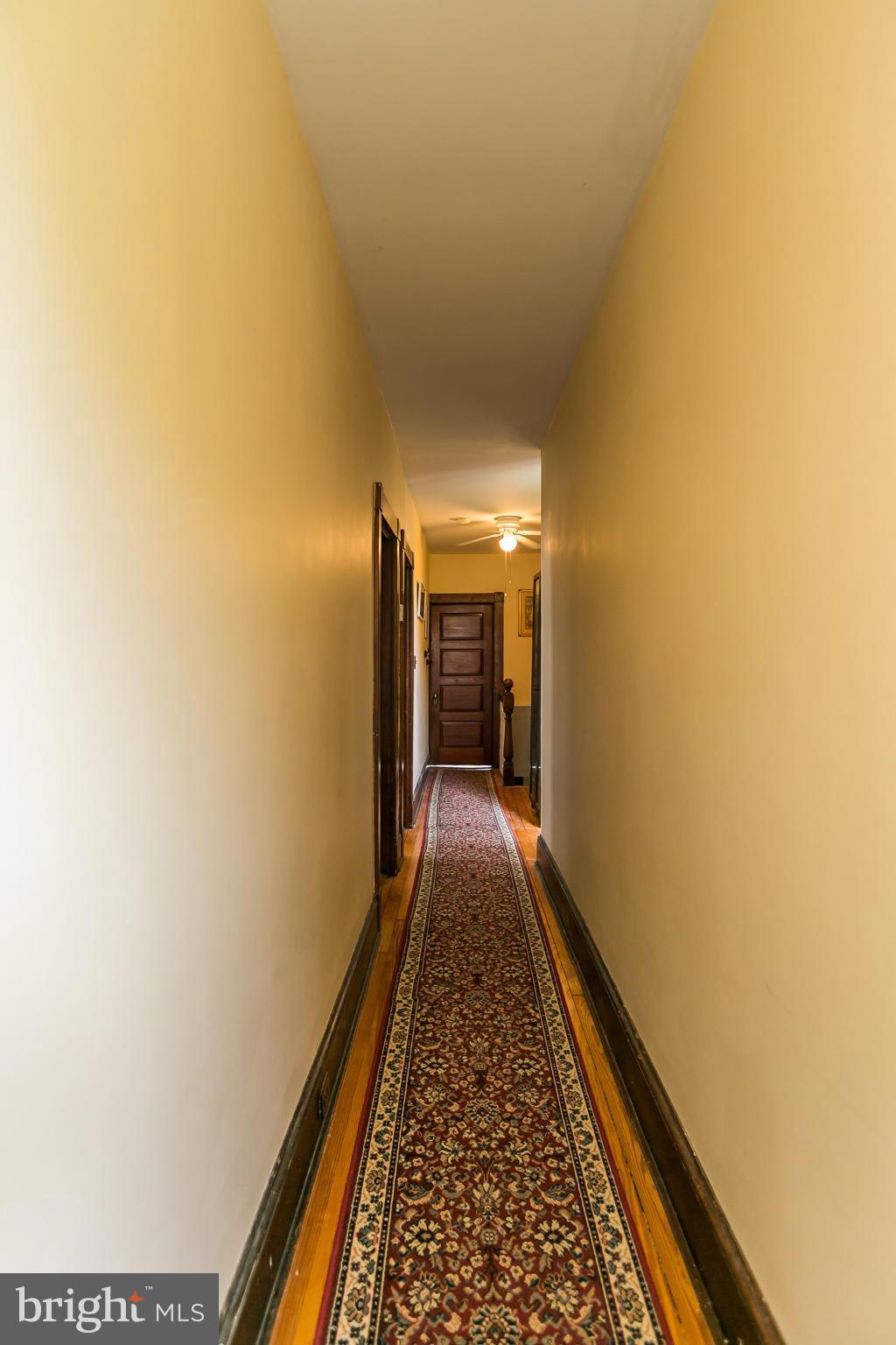 4015 Roland Avenue Baltimore, MD 21211 - Photo 21 of 30 a view of hallway with wooden floor