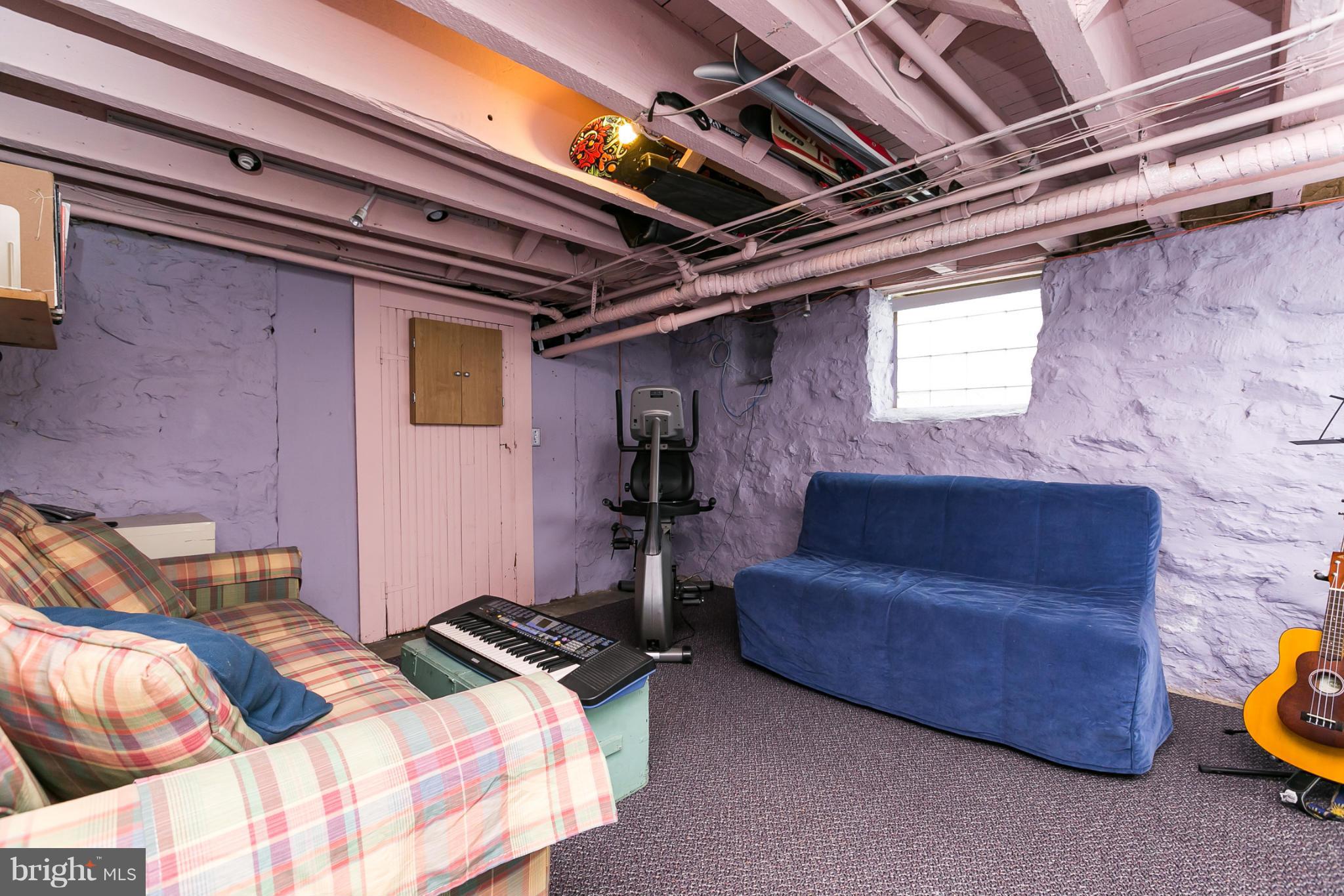 4015 Roland Avenue Baltimore, MD 21211 - Photo 22 of 30 a bed room with a bed and a couch