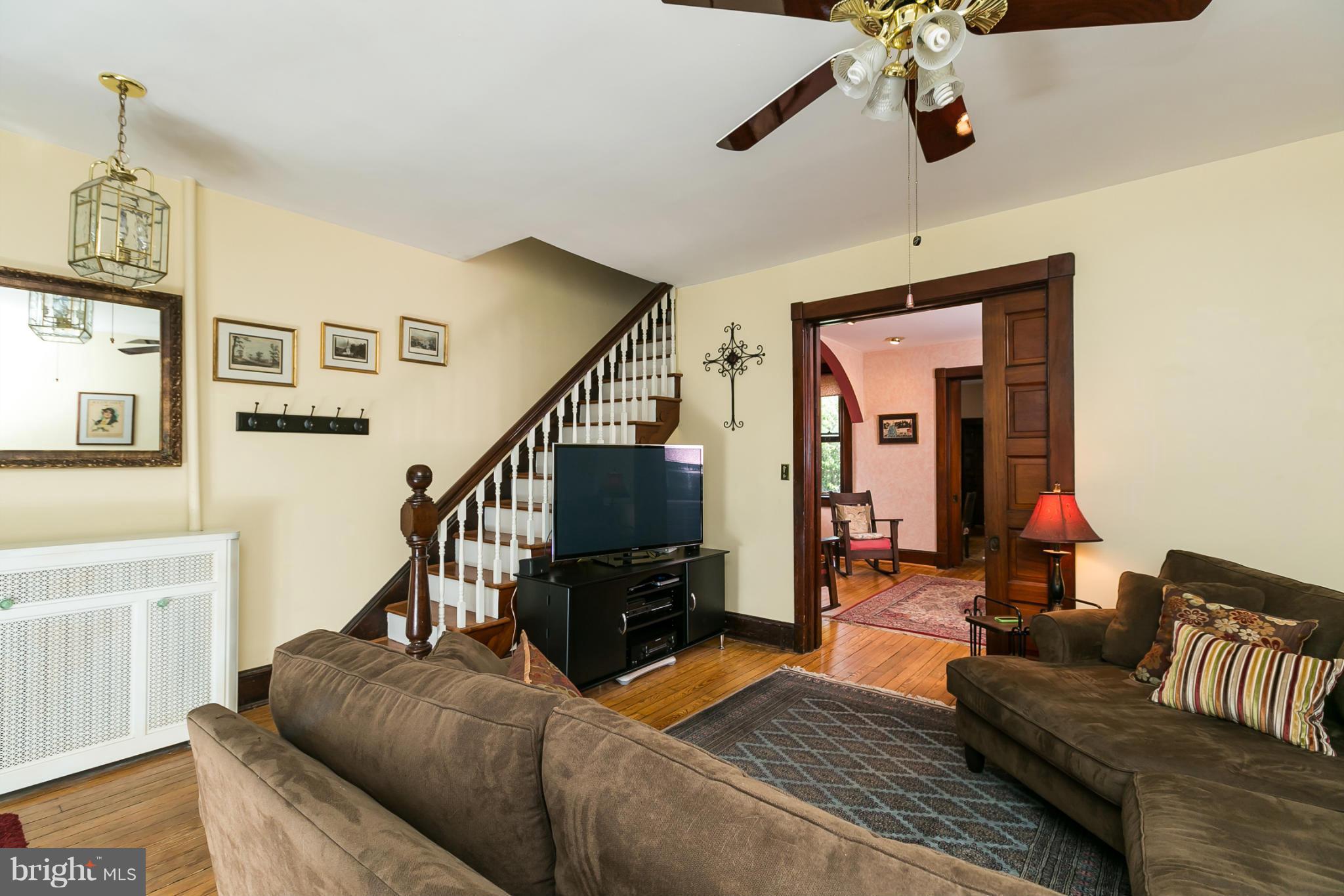 4015 Roland Avenue Baltimore, MD 21211 - Photo 4 of 30 a living room with furniture and a dining table