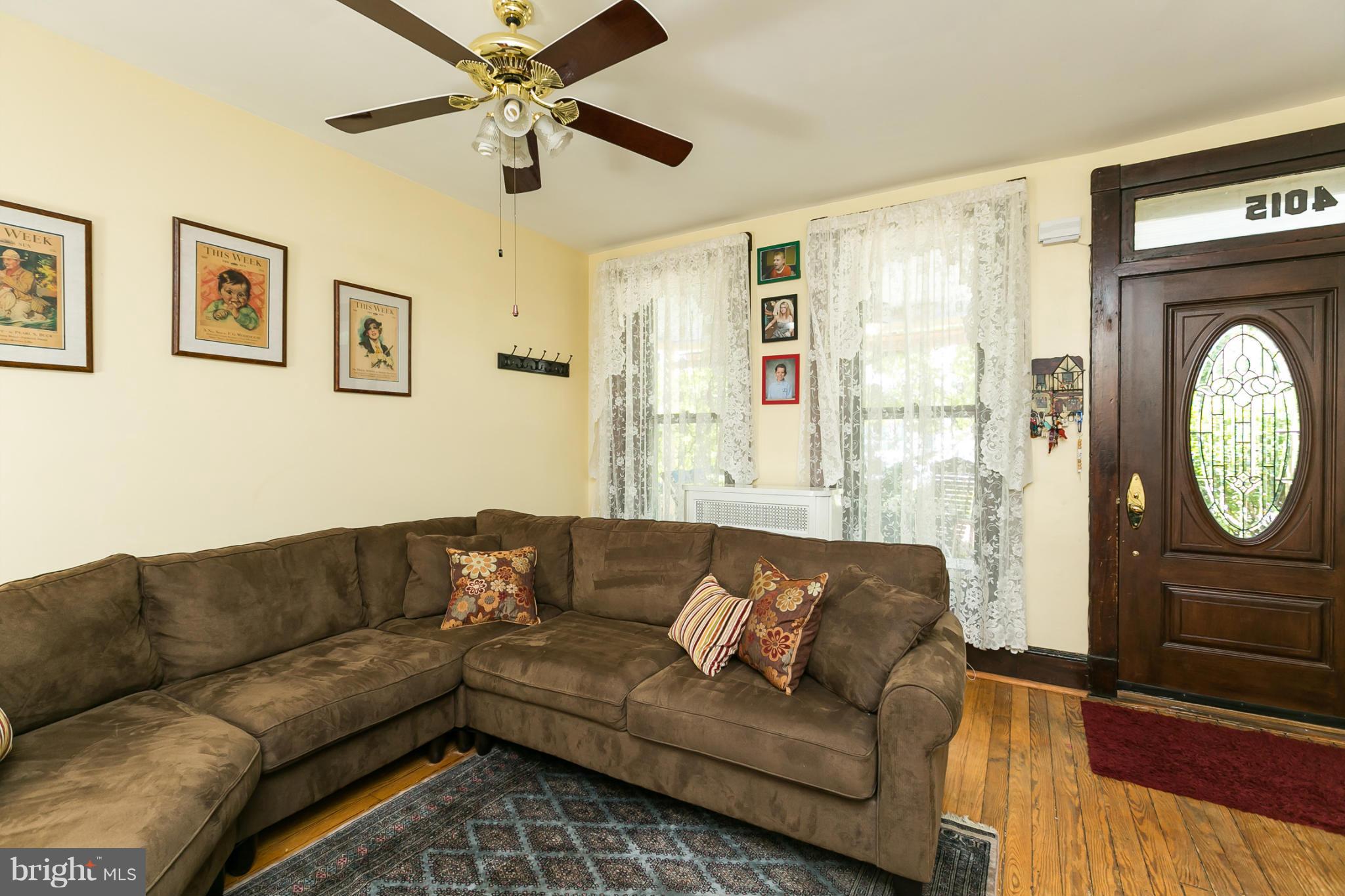 4015 Roland Avenue Baltimore, MD 21211 - Photo 5 of 30 a living room with a couch and a window