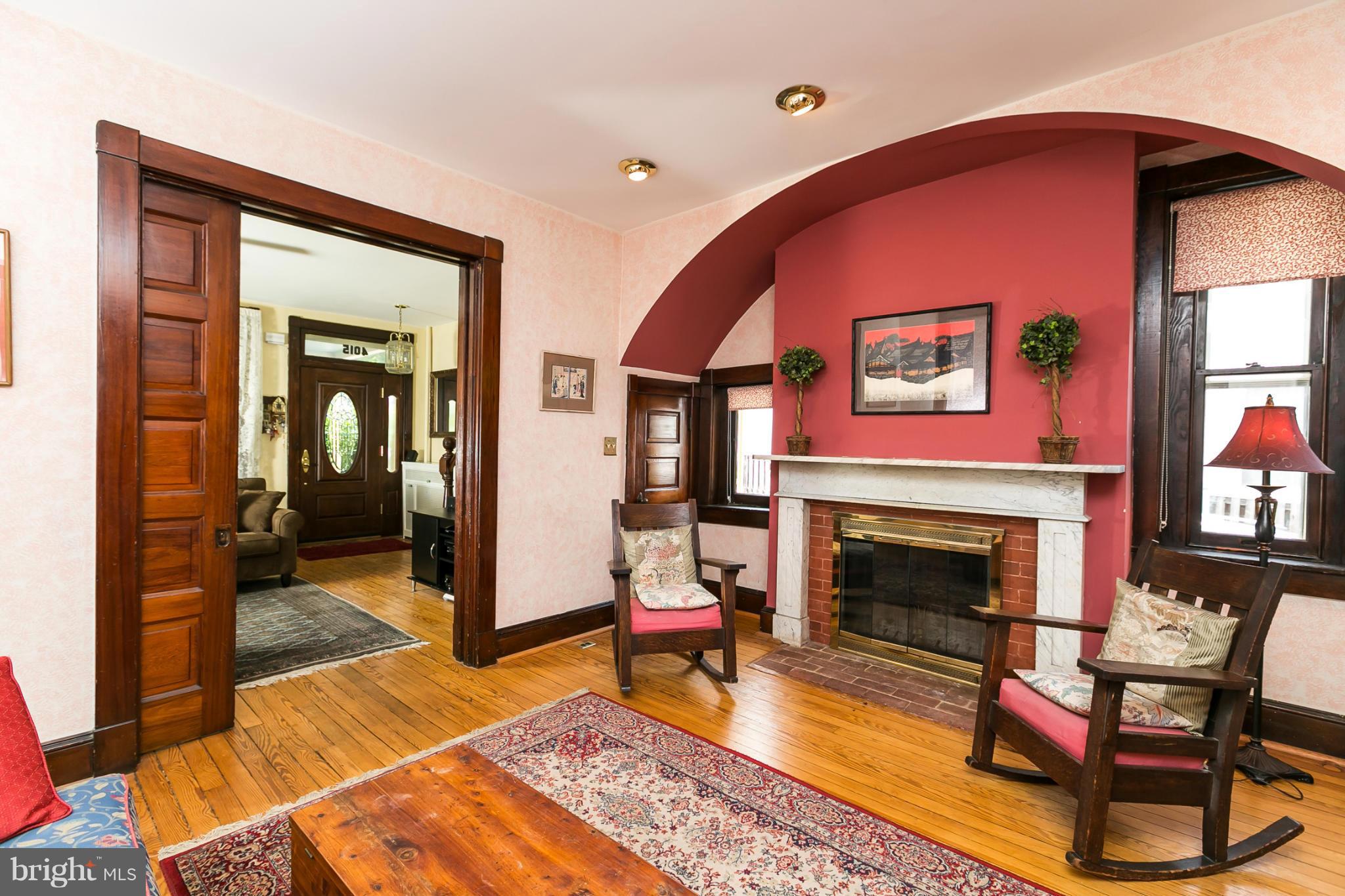 4015 Roland Avenue Baltimore, MD 21211 - Photo 6 of 30 a living room with furniture and a fireplace