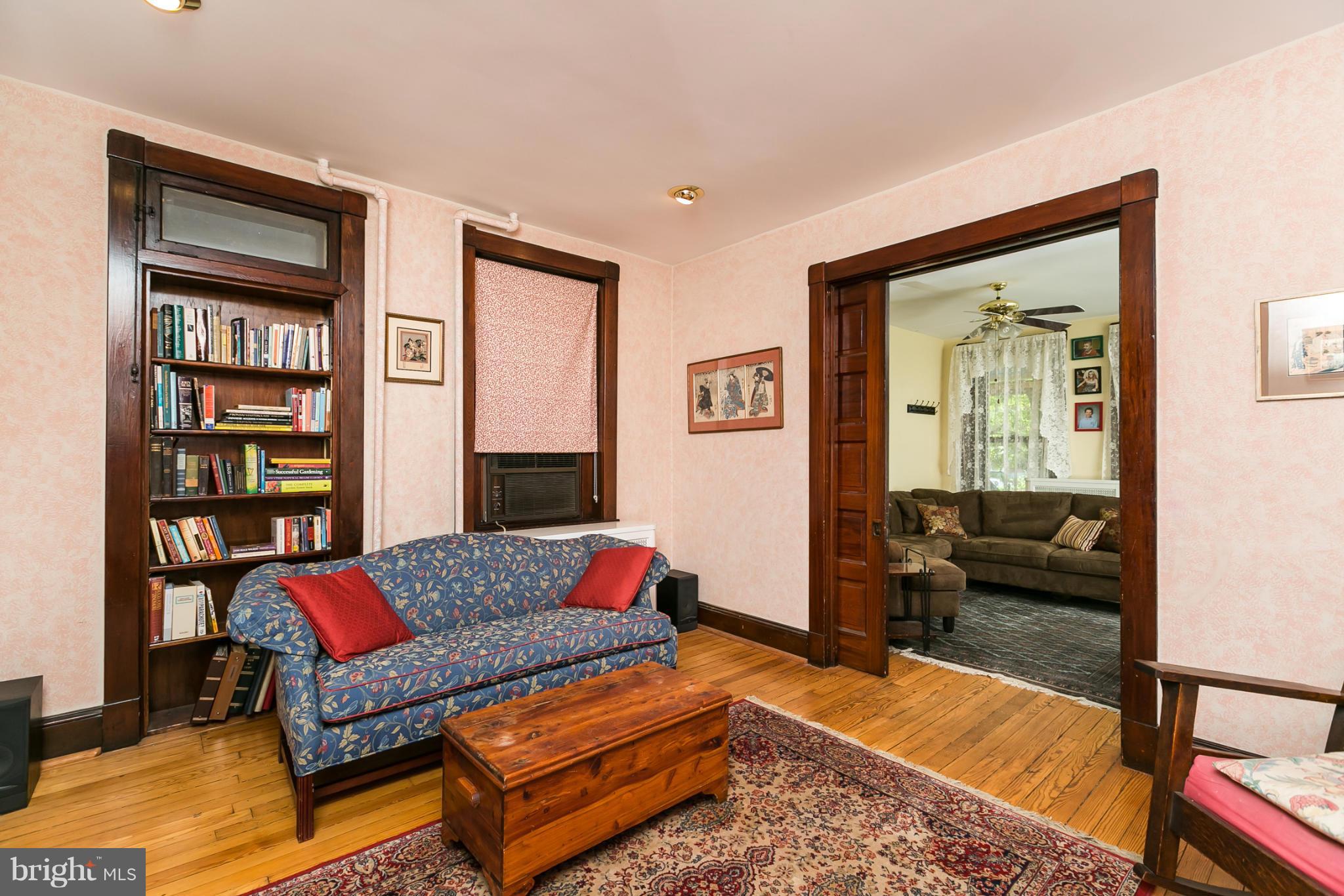 4015 Roland Avenue Baltimore, MD 21211 - Photo 7 of 30 a living room with furniture and a book shelf