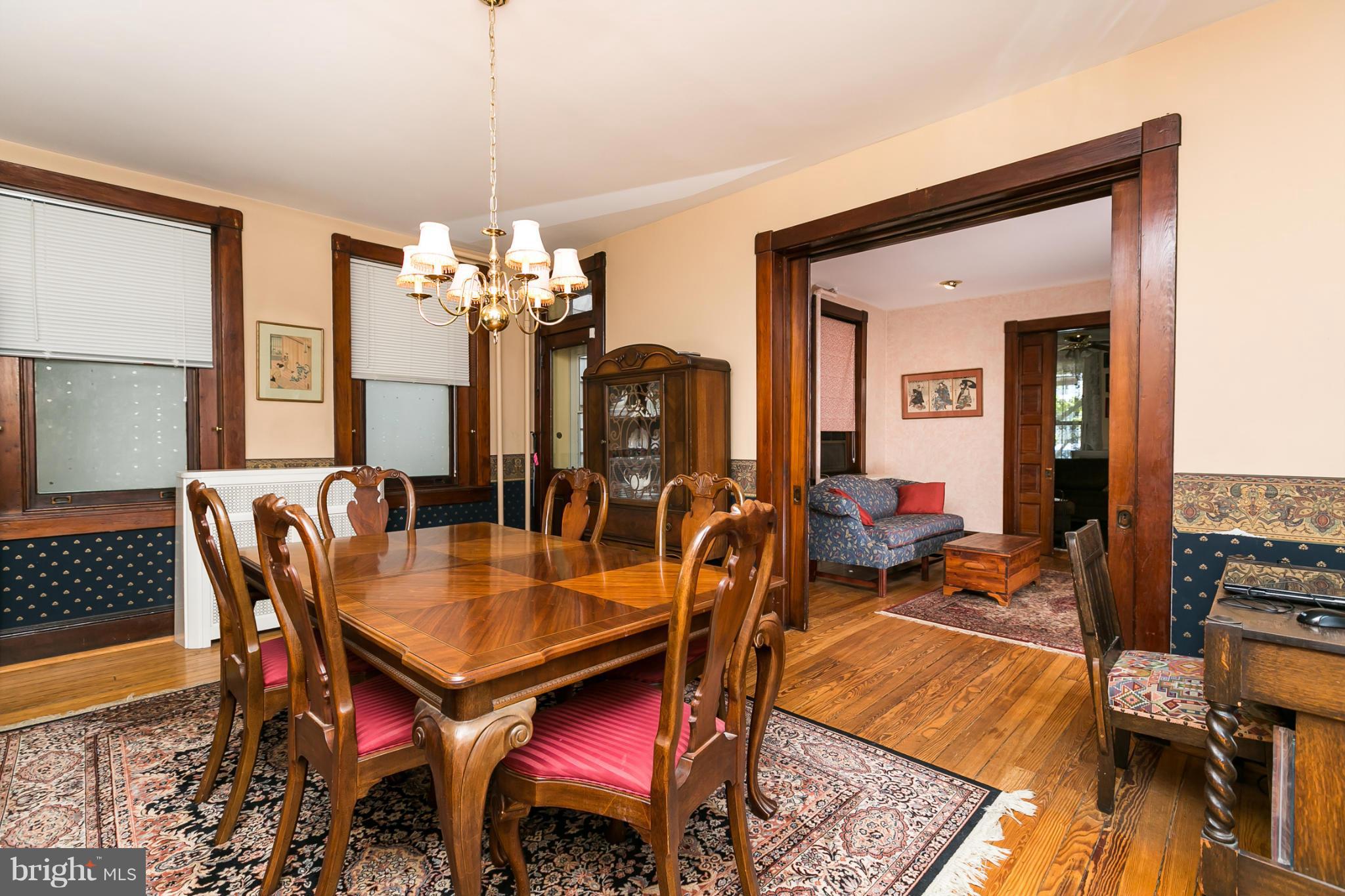 4015 Roland Avenue Baltimore, MD 21211 - Photo 8 of 30 a view of a dining room with furniture and wooden floor