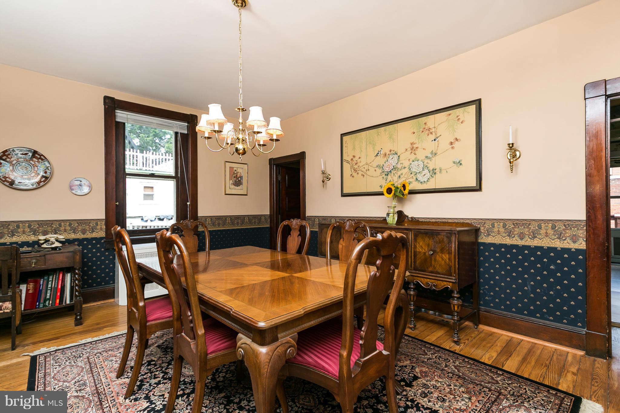4015 Roland Avenue Baltimore, MD 21211 - Photo 9 of 30 a view of a dining room with furniture and wooden floor