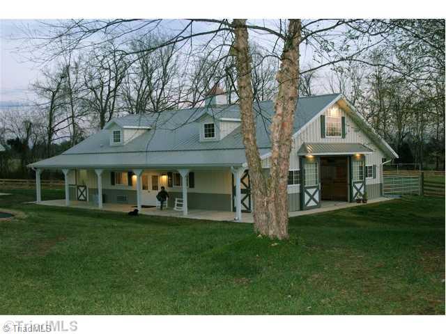 6388 Gumwood Road Oak Ridge, NC 27310 - Photo 1 of 9 Stable/Barn. Lovely 6-stall barn with extra wise center aisle, tack room with 1/2 bath and lounge area plus feed room and wash stall