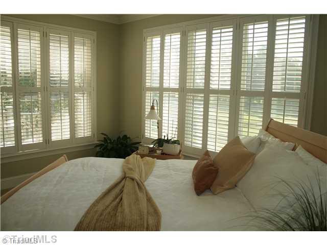 6388 Gumwood Road Oak Ridge, NC 27310 - Photo 3 of 9 Master Bedroom. Exceptional views overlooking the pastures from the first floor master bedroom.