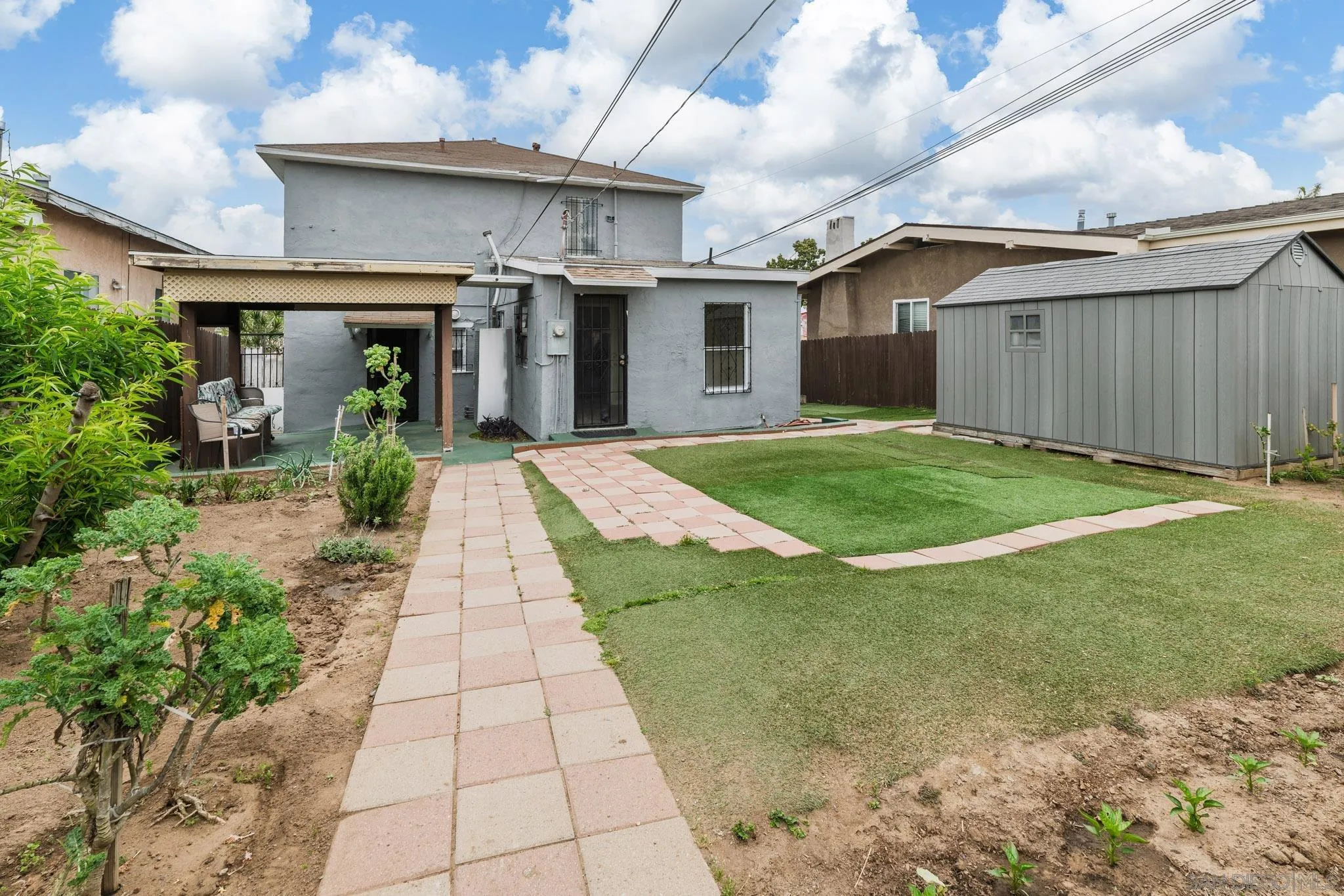 a view of a back yard of the house