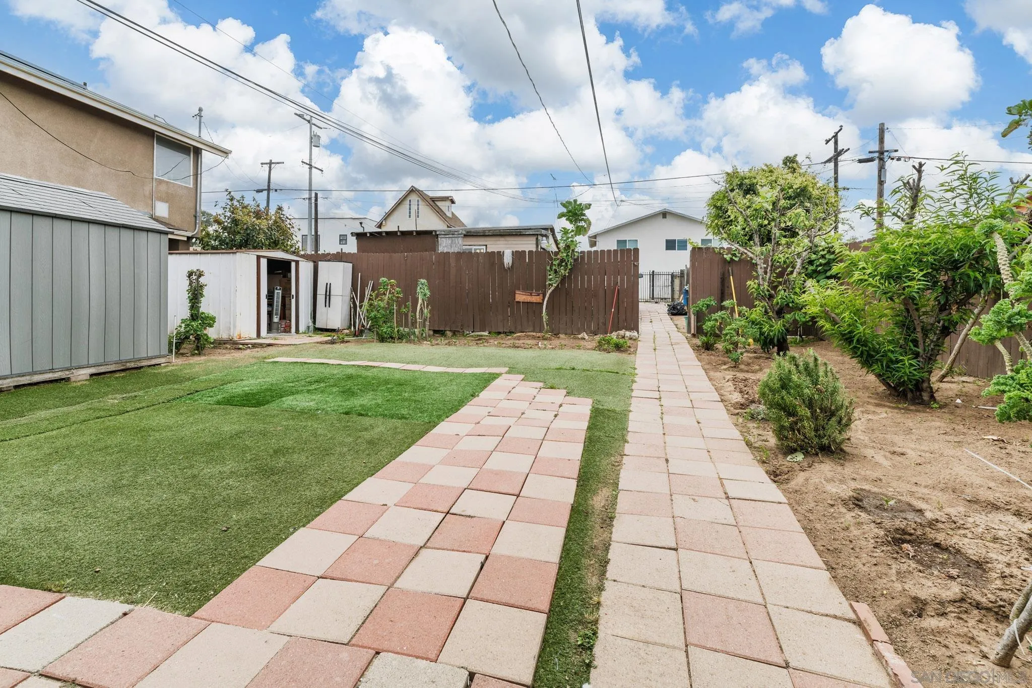 2925 Franklin Avenue San Diego, CA 92113 - Photo 22 of 36 a front view of a house with a yard