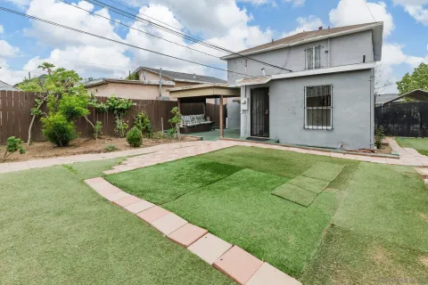 a view of a backyard of the house