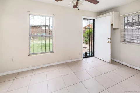 a view of an empty room with a window