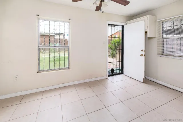 a view of an empty room with a window