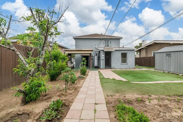 a view of a house with a garden