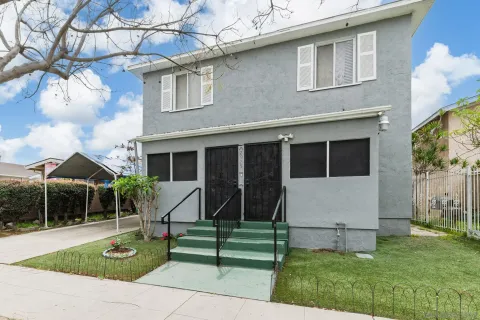 a view of house with backyard and garden