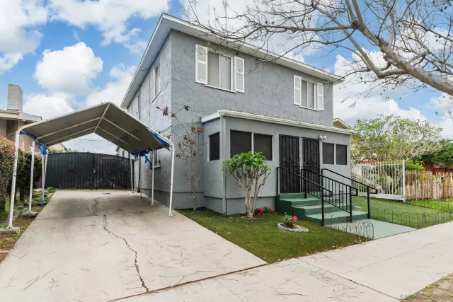 a front view of a house with garden