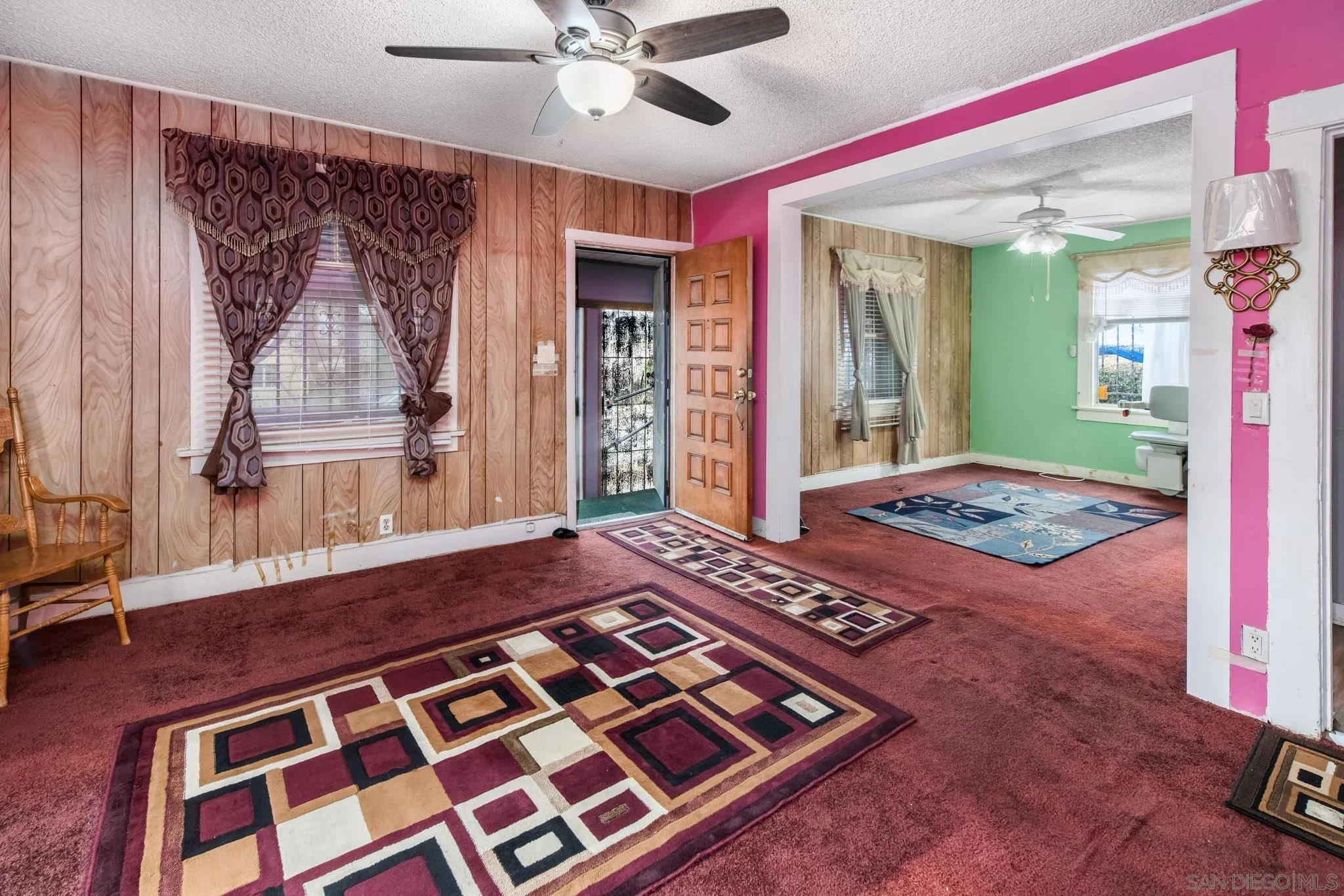 2925 Franklin Avenue San Diego, CA 92113 - Photo 7 of 36 a bedroom with a bed and a chandelier