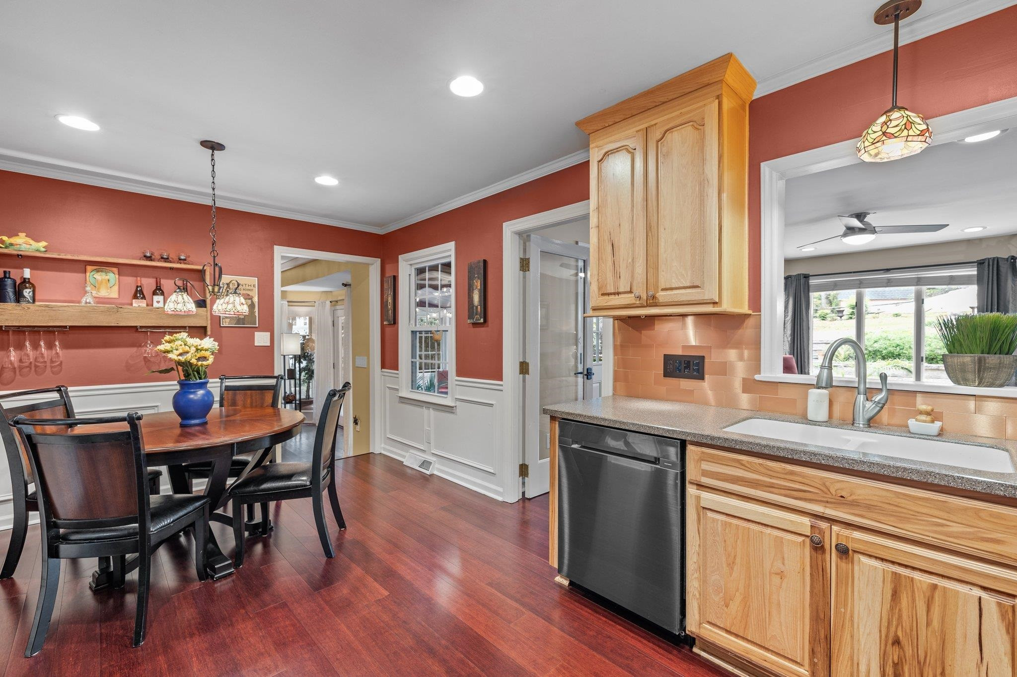 6305 Rushingbrook Drive Raleigh, NC 27612 - Photo 15 of 48 a kitchen with stainless steel appliances granite countertop a kitchen island hardwood floor sink stove dining table and chairs
