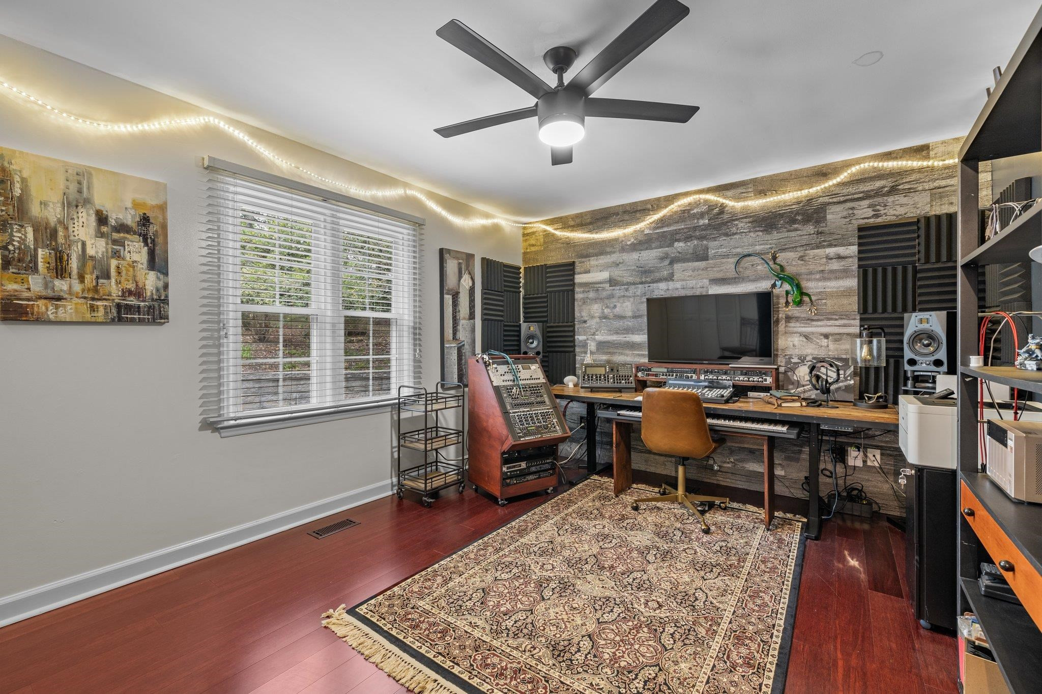 6305 Rushingbrook Drive Raleigh, NC 27612 - Photo 20 of 48 a living room with furniture and a flat screen tv