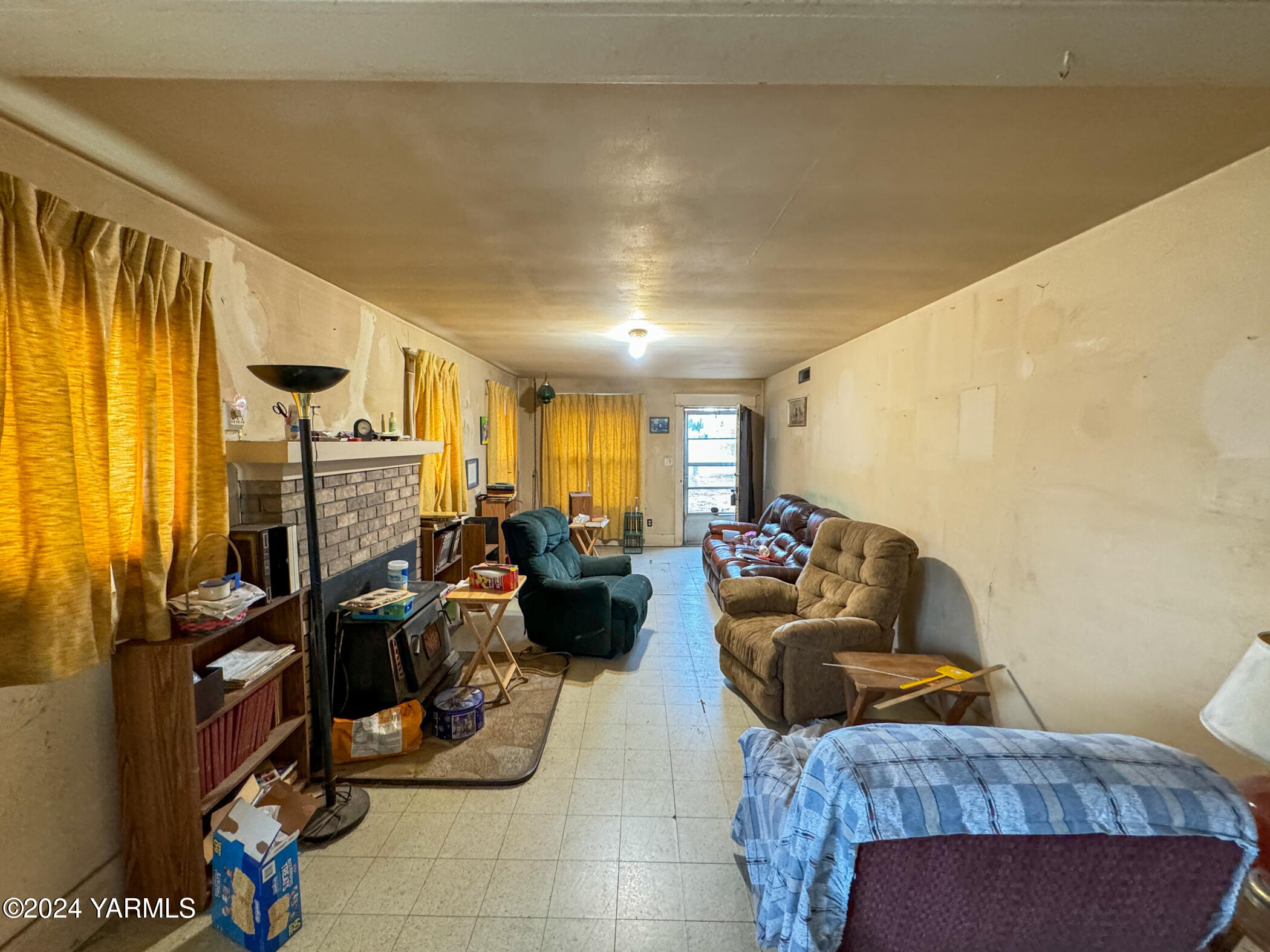 10309 Hughes Road Yakima, WA 98903 - Photo 5 of 14 a living room with furniture a couch and large window