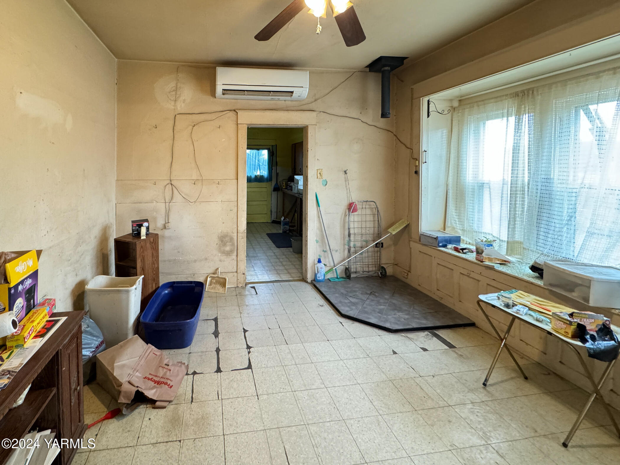 10309 Hughes Road Yakima, WA 98903 - Photo 6 of 14 a living room with furniture and a chandelier