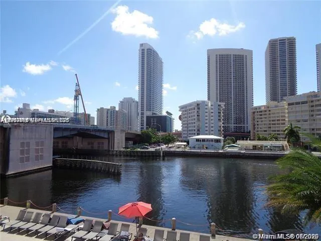 a view of a lake with tall buildings