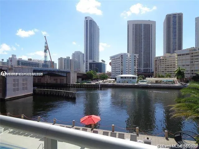 a view of a lake with tall buildings