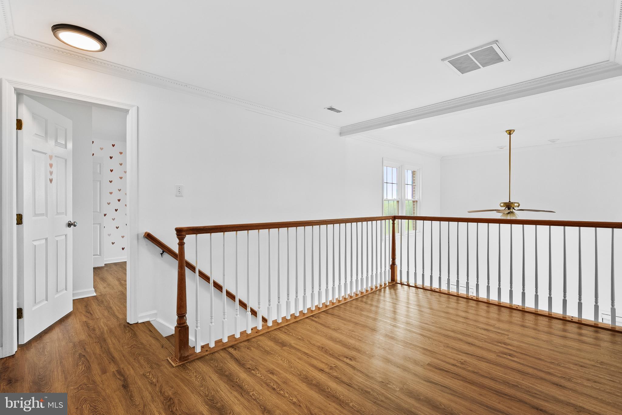 42827 Spinks Ferry Road Leesburg, VA 20176 - Photo 31 of 71 a view of a hallway with wooden floor