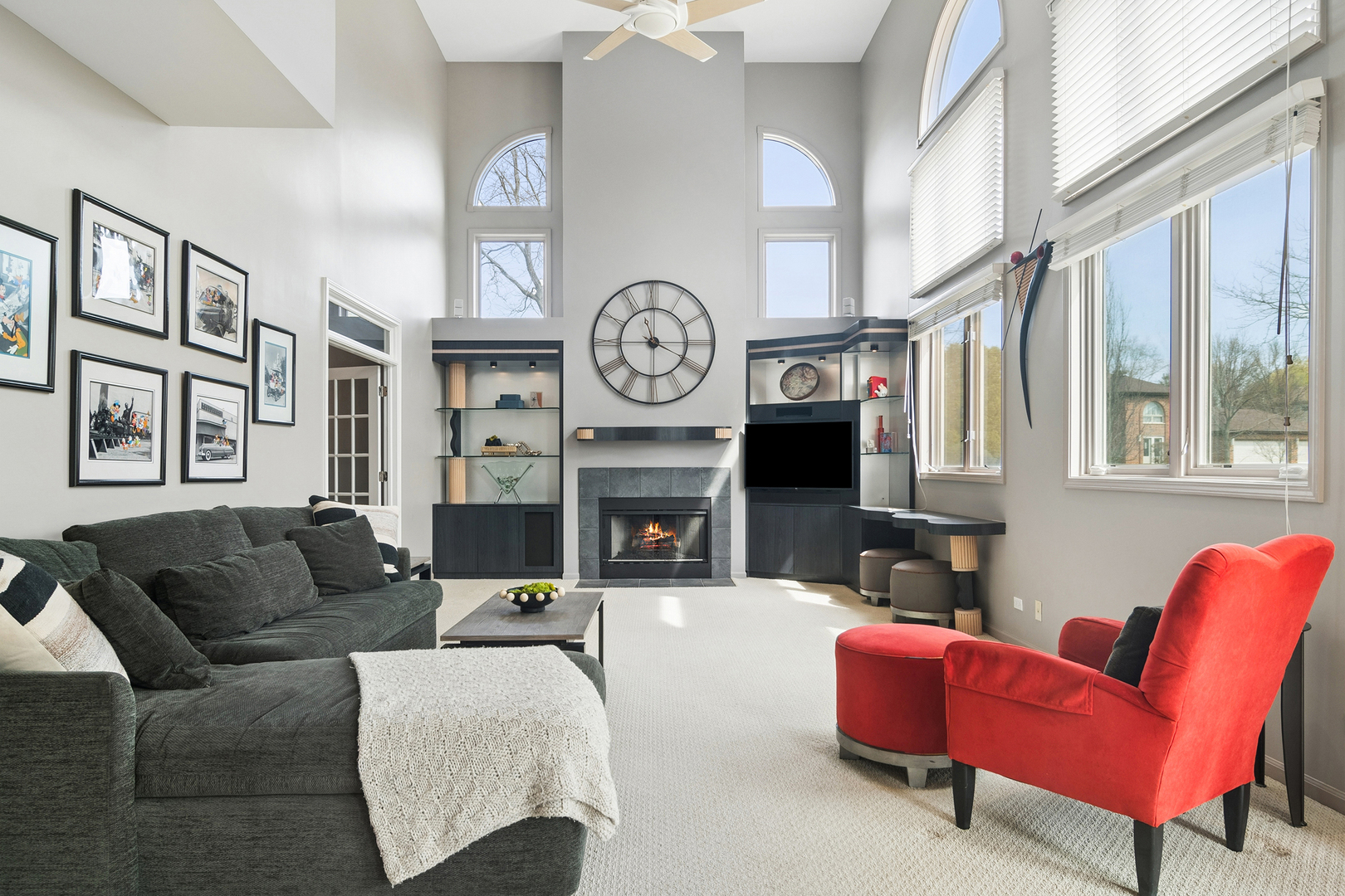 2038 Sheridan Road Buffalo Grove, IL 60089 - Photo 12 of 44 a living room with furniture a clock and a fireplace