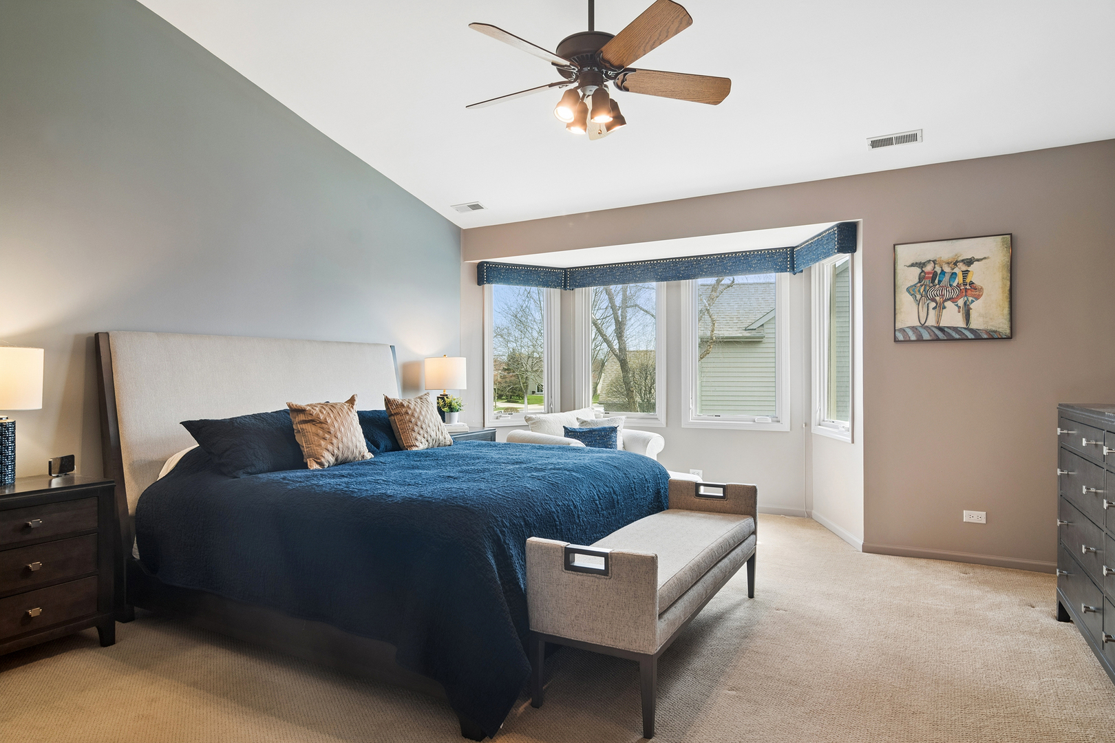 2038 Sheridan Road Buffalo Grove, IL 60089 - Photo 17 of 44 a bedroom with a bed and a chandelier