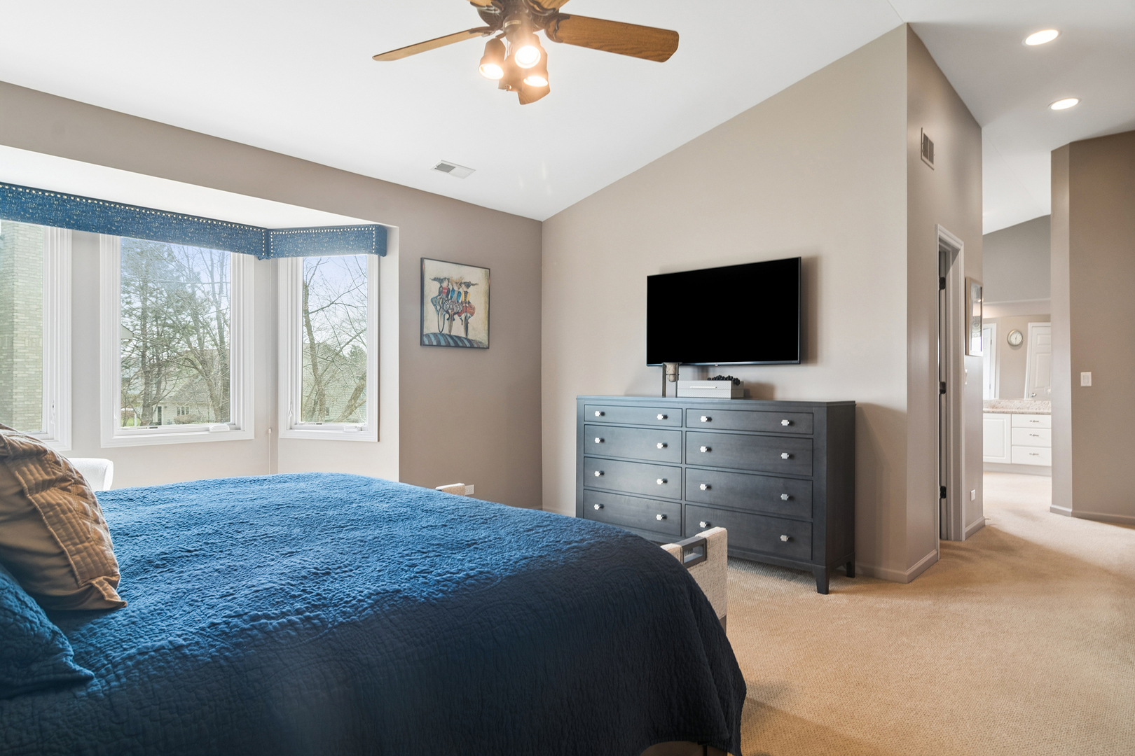 2038 Sheridan Road Buffalo Grove, IL 60089 - Photo 18 of 44 a bedroom with a bed and a flat screen tv